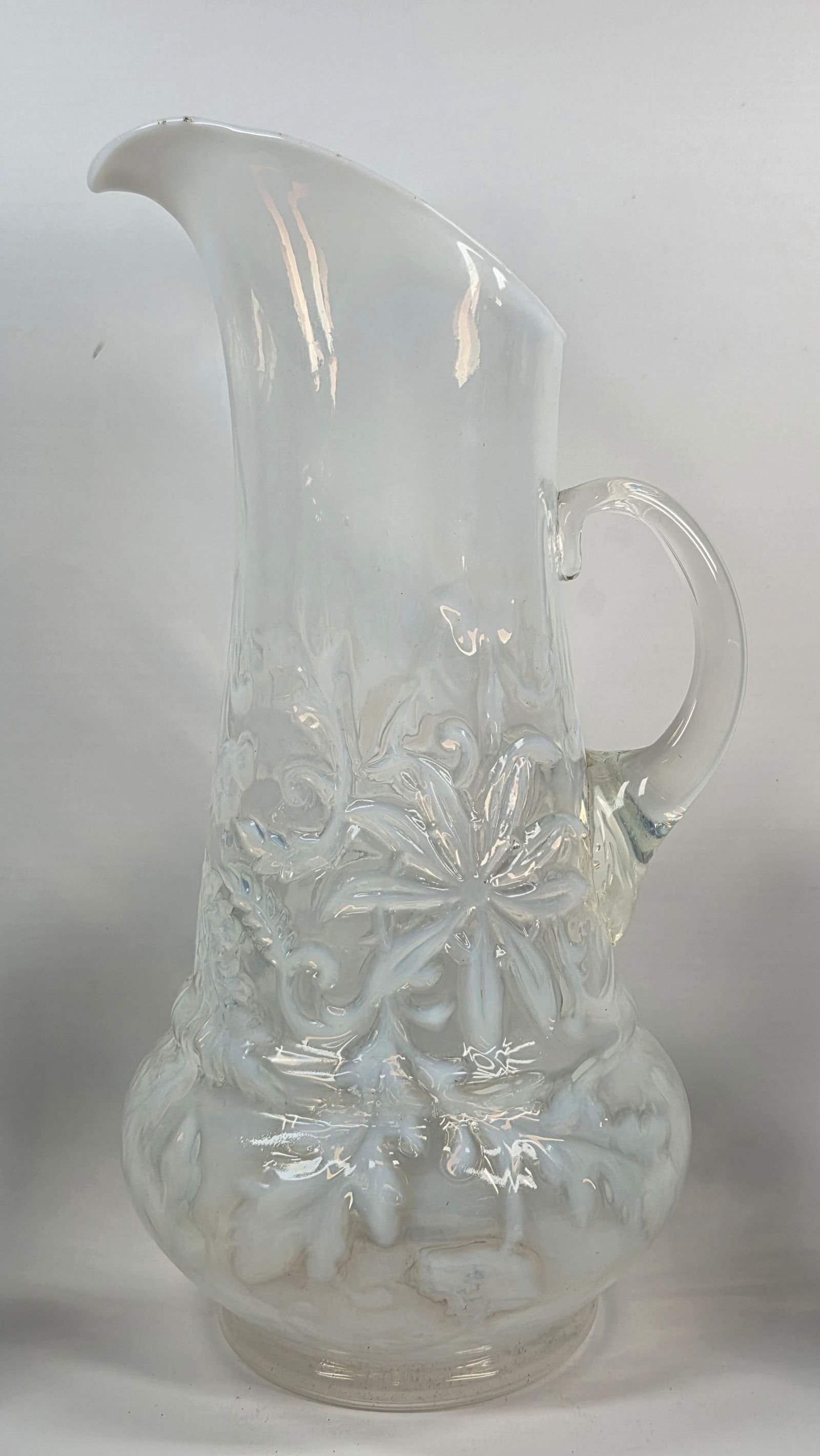 WHITE OPALESCENT POINTSETTA WATER PITCHER: REMAINS IN GOOD CONDITION, SHOWING SOME TYPICAL USAGE WEAR. NO CHIPS OR CRACKS.