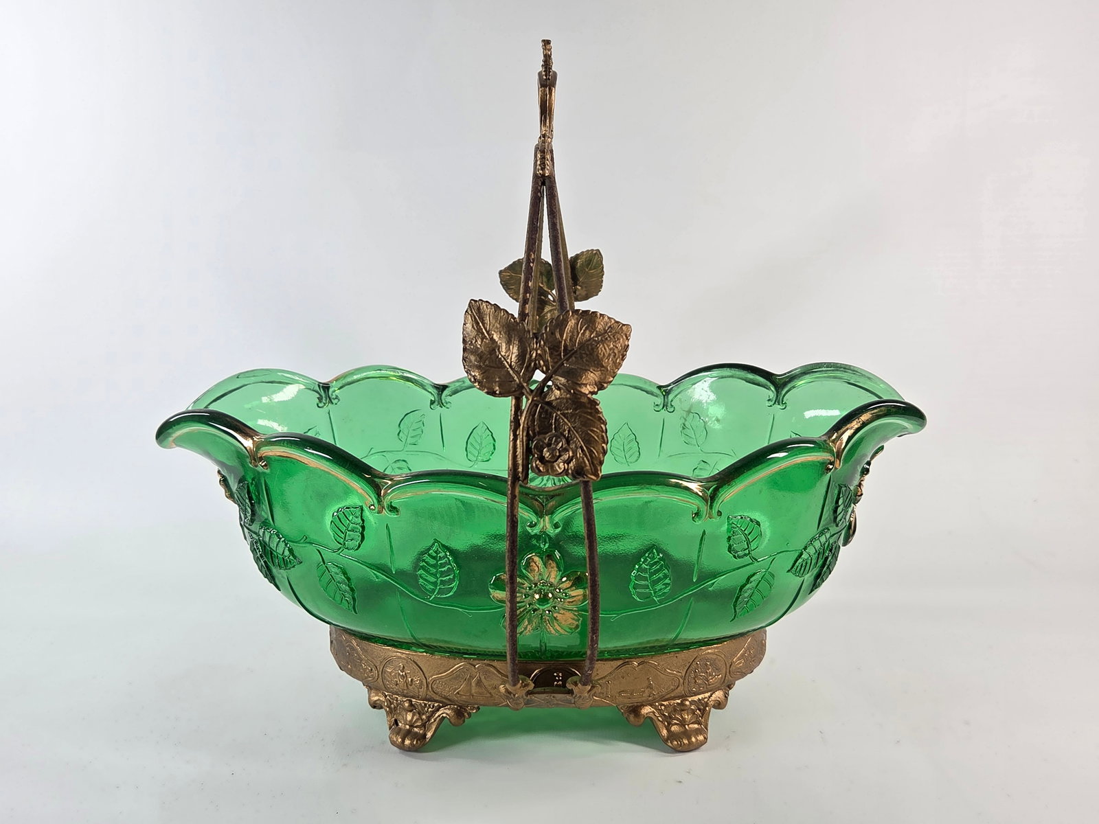 GREEN EMBOSSED GLASS BRIDE'S BASKET IN GOLD PAINTED HOLDER: REMAINS IN GOOD CONDITION, SHOWING SOME PAINT WEAR. NO CHIPS OR CRACKS. HOLDER HAS BEEN PAINTED GOLD.