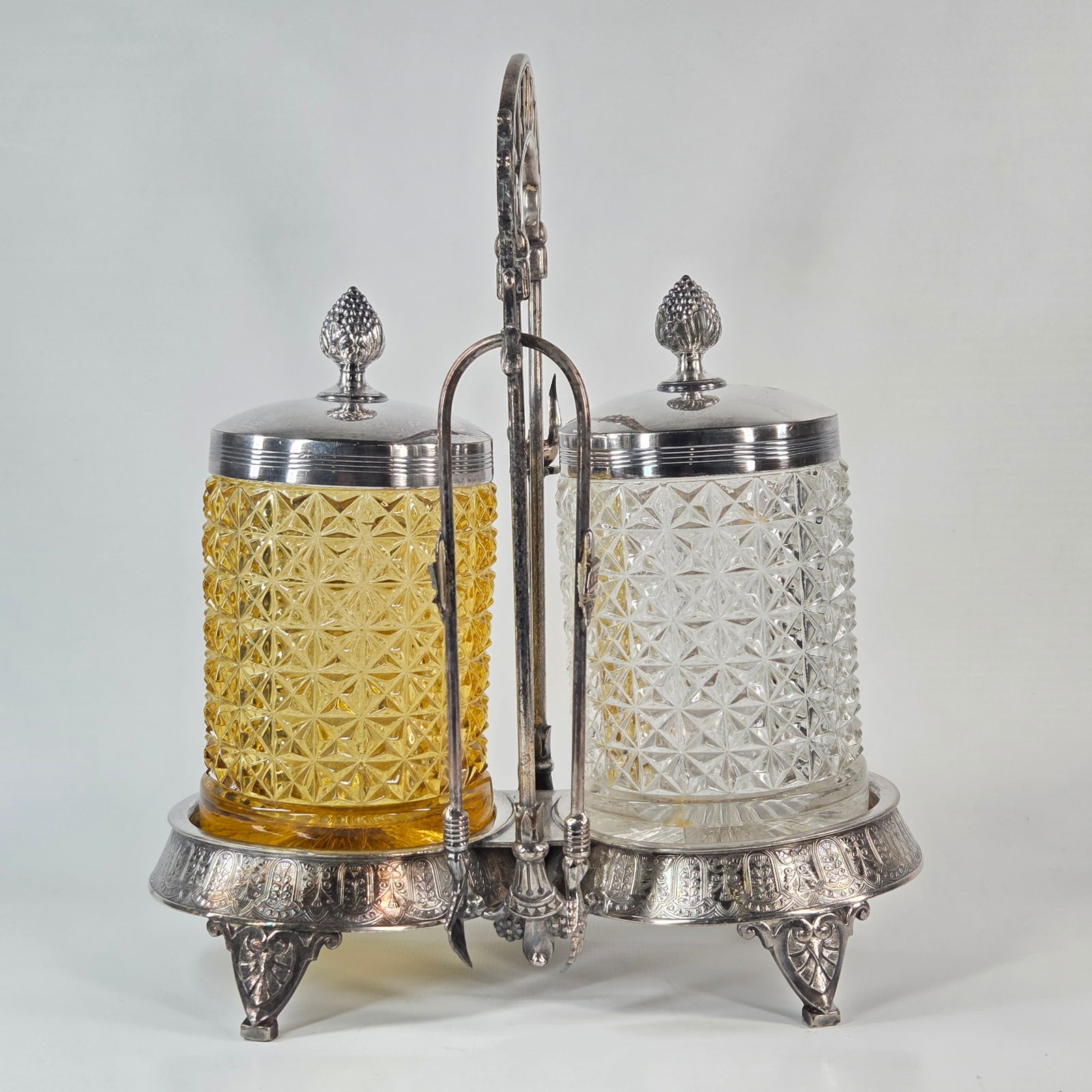 ORNATE VICTORIAN DOUBLE PICKLE CASTOR W/ AMBER & CLEAR GLASS: REMAINS IN GOOD CONDITION, SHOWING SOME TYPICAL USAGE WEAR.