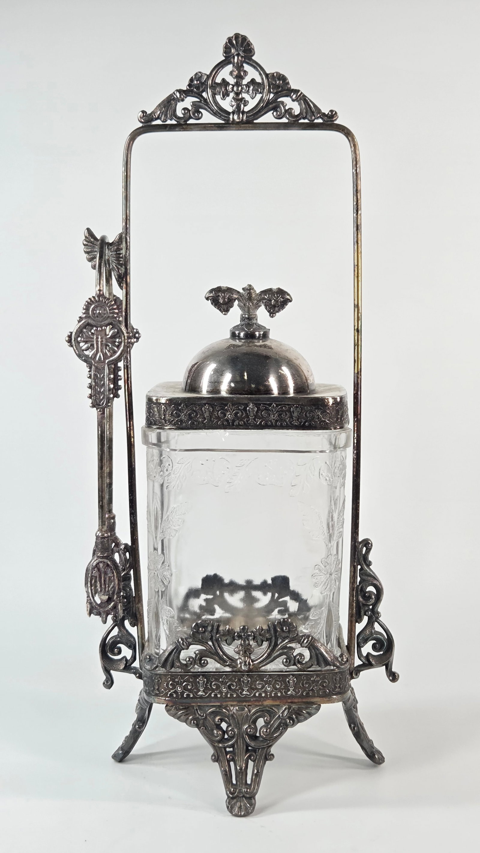VICTORIAN EMBOSSED GLASS PICKLE CASTOR IN ORNATE HOLDER: REMAINS IN GOOD CONDITION, SHOWING SOME TYPICAL USAGE WEAR. NO CHIPS OR CRACKS. NEEDS POLISHED.