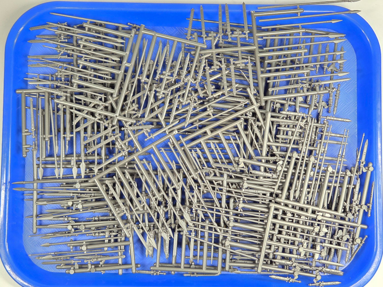 VARIOUS WAR GAMING SPEARS & SWORDS: ALL PIECES ATTACHED TO PLASTIC RUNNERS. MISSING PIECES.