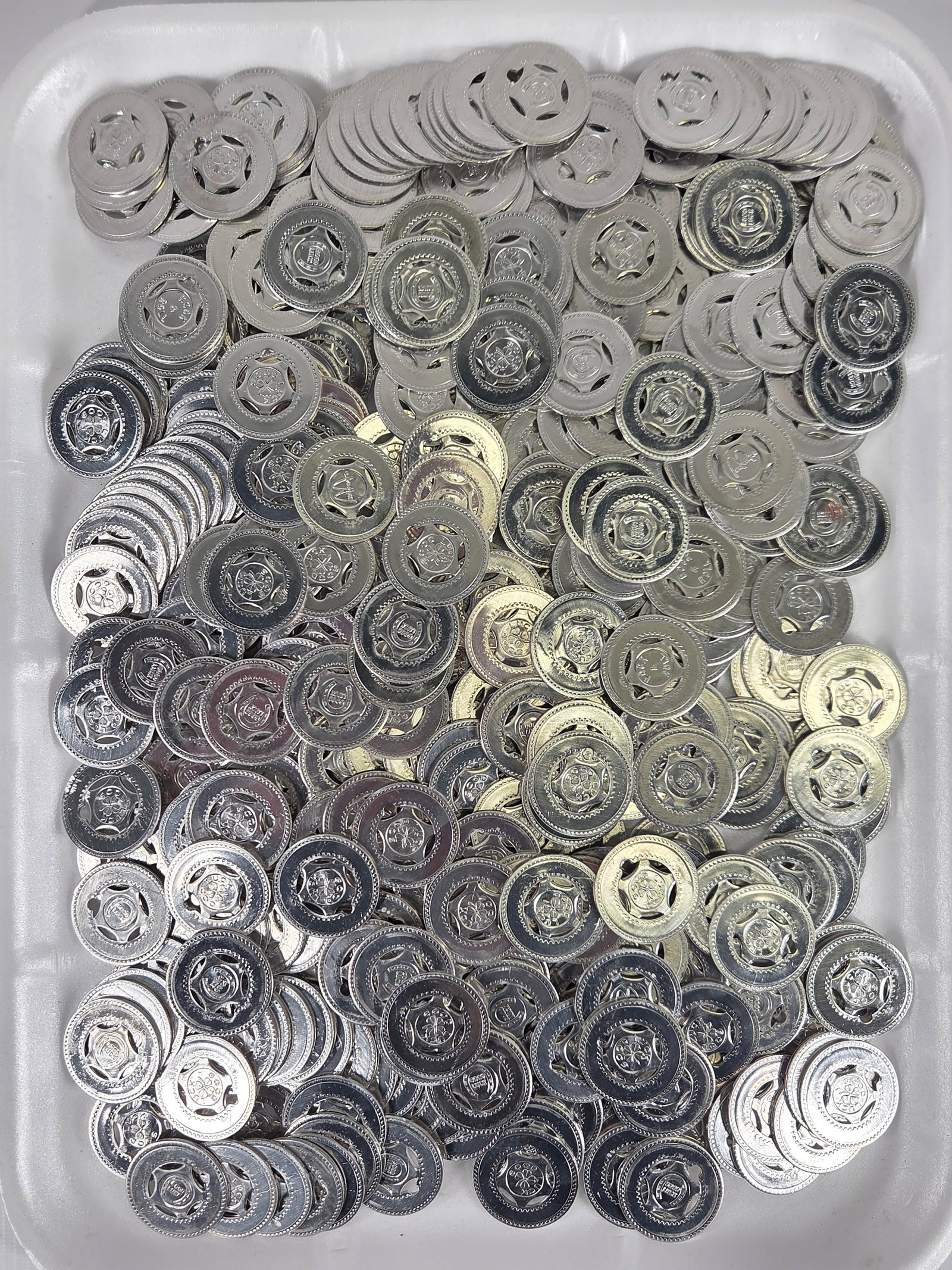 LARGE ASSORTMENT OF GOOD LUCK TOKENS: ALL REMAIN IN GOOD CONDITION.