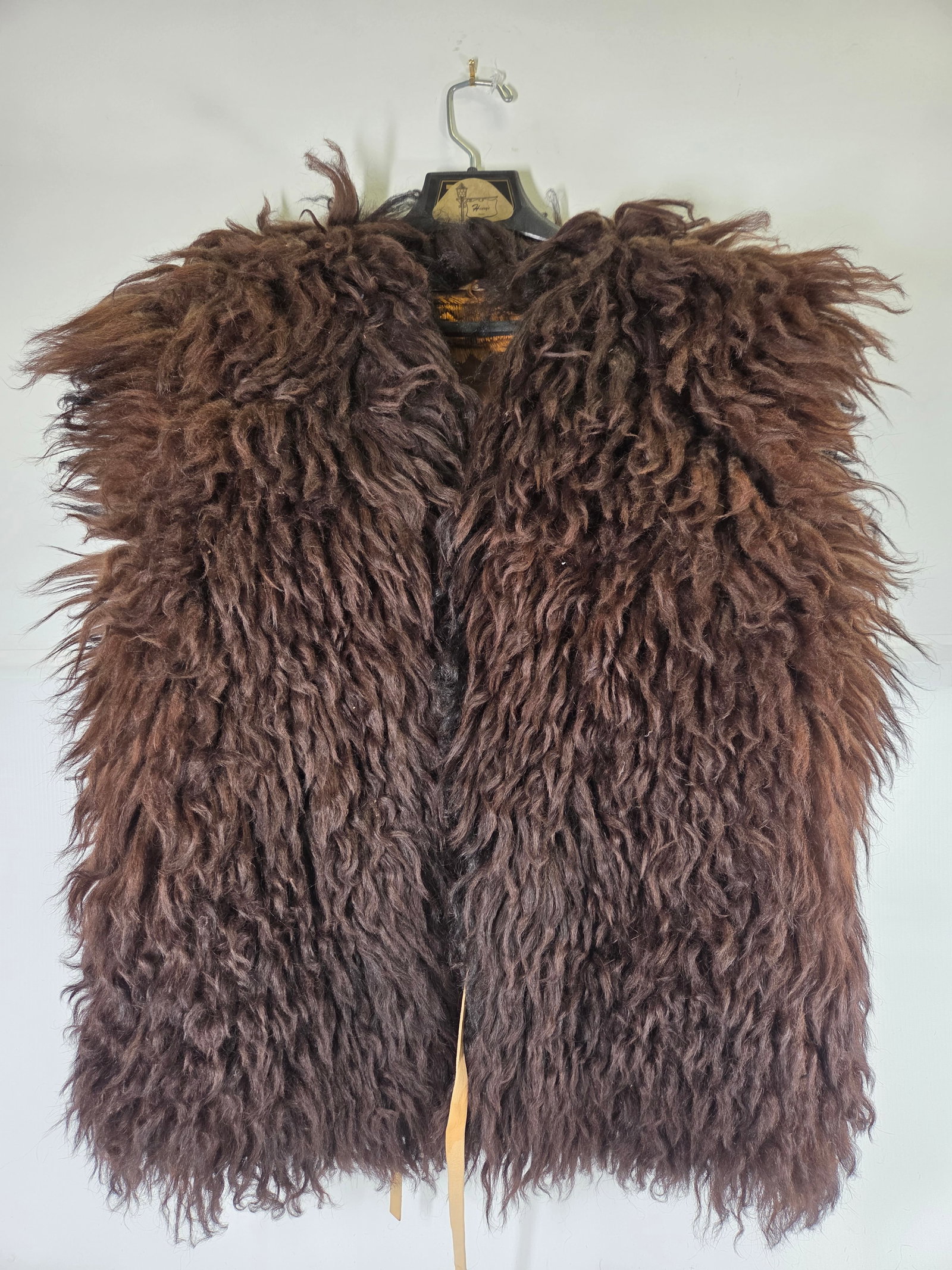 ANTIQUE BUFFALO HIDE VEST: REMAINS IN FAIR TO GOOD CONDITION, SHOWING SOME TYPICAL WEAR.