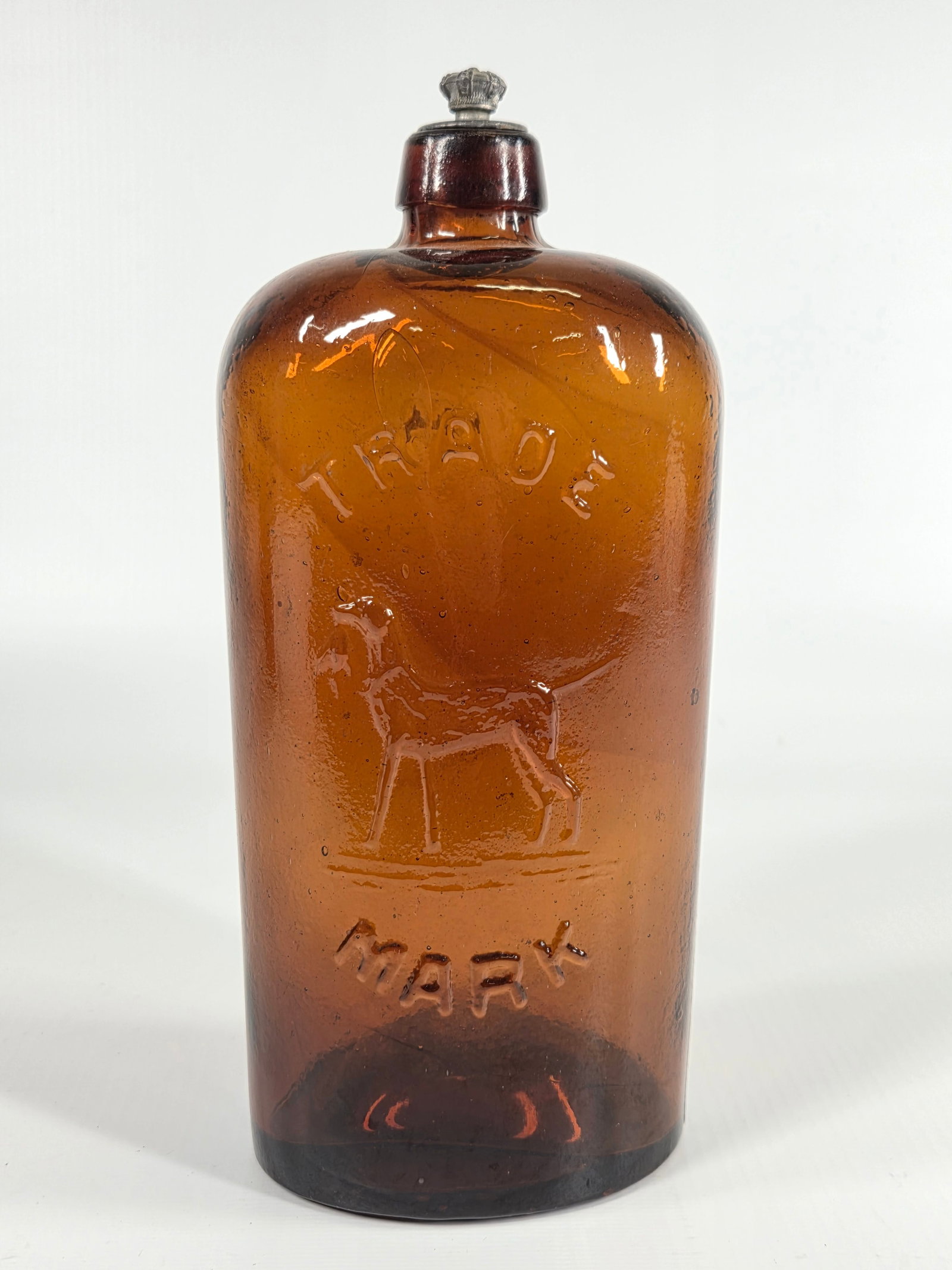 J.J.W. PETERS DOG W/ DUCK AMBER GLASS BITTER BOTTLES: REMAINS IN GOOD CONDITION, SHOWING SOME TYPICAL USAGE WEAR. NO CHIPS OR CRACKS.