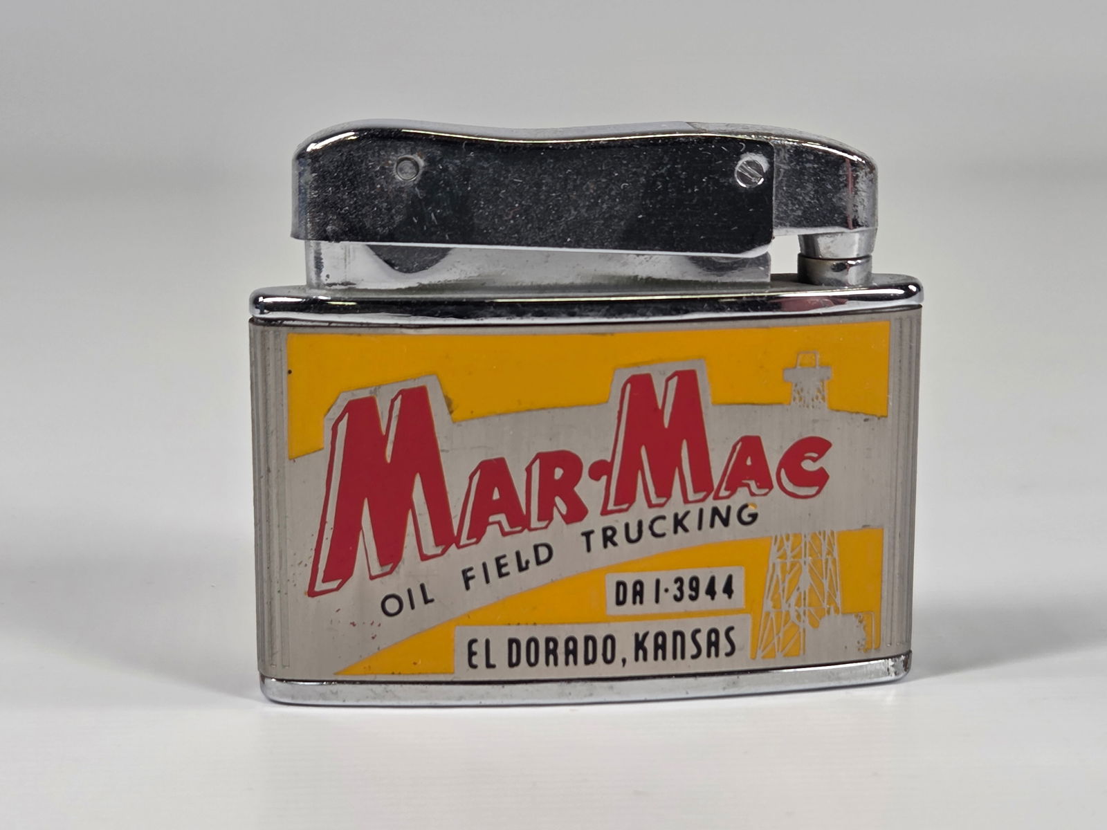 JAPAN MAR MAC OIL FIELD ADVERTISING LIGHTER: REMAINS IN GOOD CONDITION, SHOWING SOME TYPICAL USAGE WEAR.