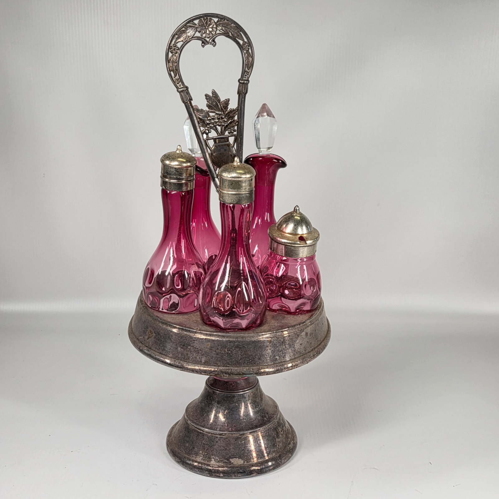 VICTORIAN ERA CRANBERRY GLASS CRUET SET IN CASTOR (1 of 5)