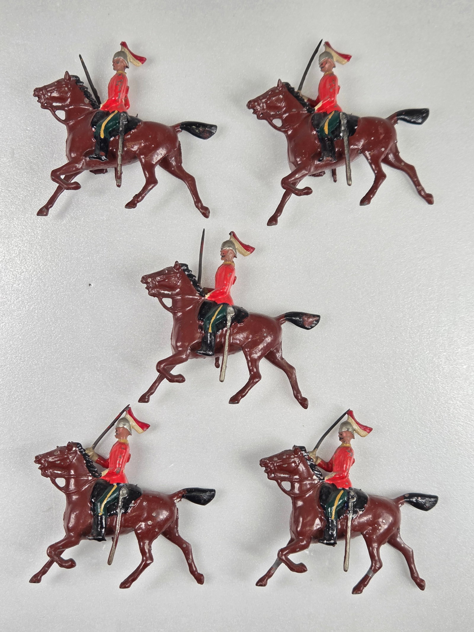 SET OF 5 BRITAIN MOUNTED LANCERS: ALL REMAIN IN GOOD CONDITION, SHOWING SOME TYPICAL WEAR.