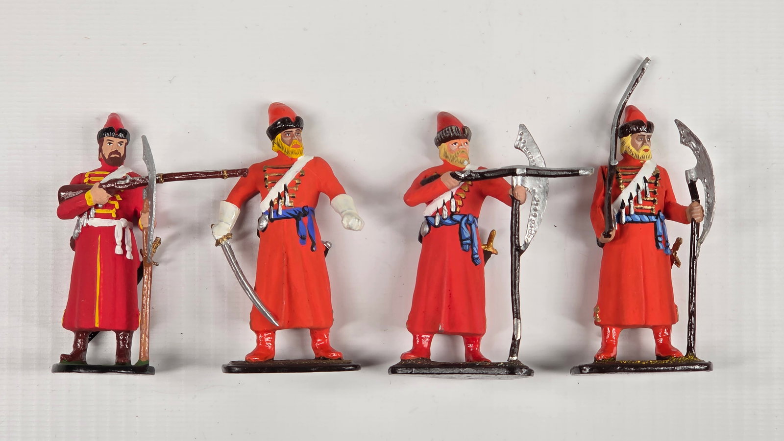 SET OF 4 RUSSIAN STRELETZ TOY SOLDIERS: ALL REMAIN IN VERY GOOD CONDITION.