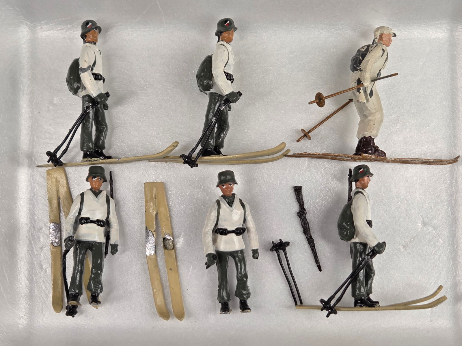 SET OF 6 HAND PAINTED LEAD SOLDIERS SKIERS: ALL REMAIN IN GOOD CONDITION, SHOWING SOME TYPICAL WEAR. 3 WITH LOOSE SKIS.
