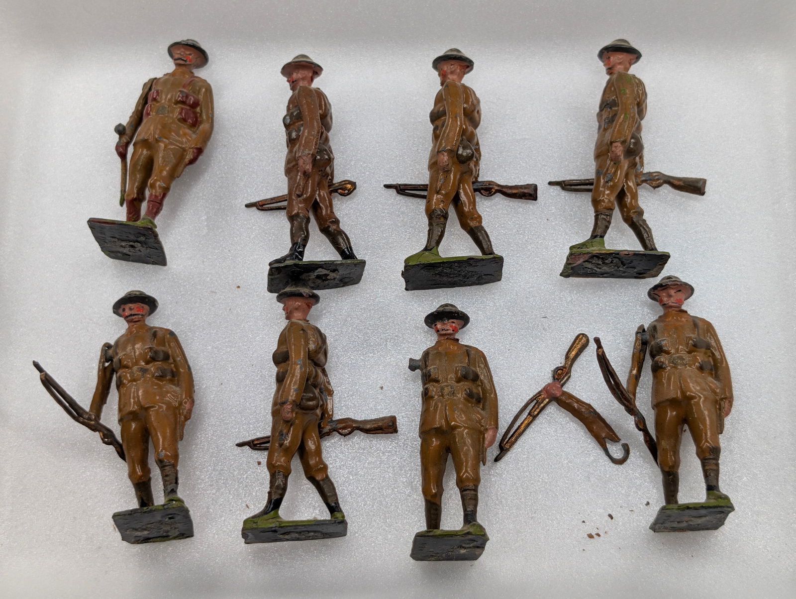 SET OF 8 VINTAGE BRITAINS LEAD SOLDIERS: ALL REMAIN IN GOOD CONDITION, SHOWING SOME TYPICAL PAINT WEAR. ONE WITH BROKEN ARM / SHOULDER RING.