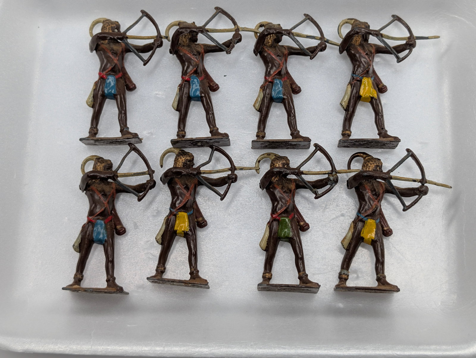 SET OF 8 VINTAGE BRITAINS LEAD TRIBAL WARRIORS: ALL REMAIN IN GOOD CONDITION, SHOWING SOME TYPICAL PAINT WEAR AND BENDS IN BOW & ARROWS.