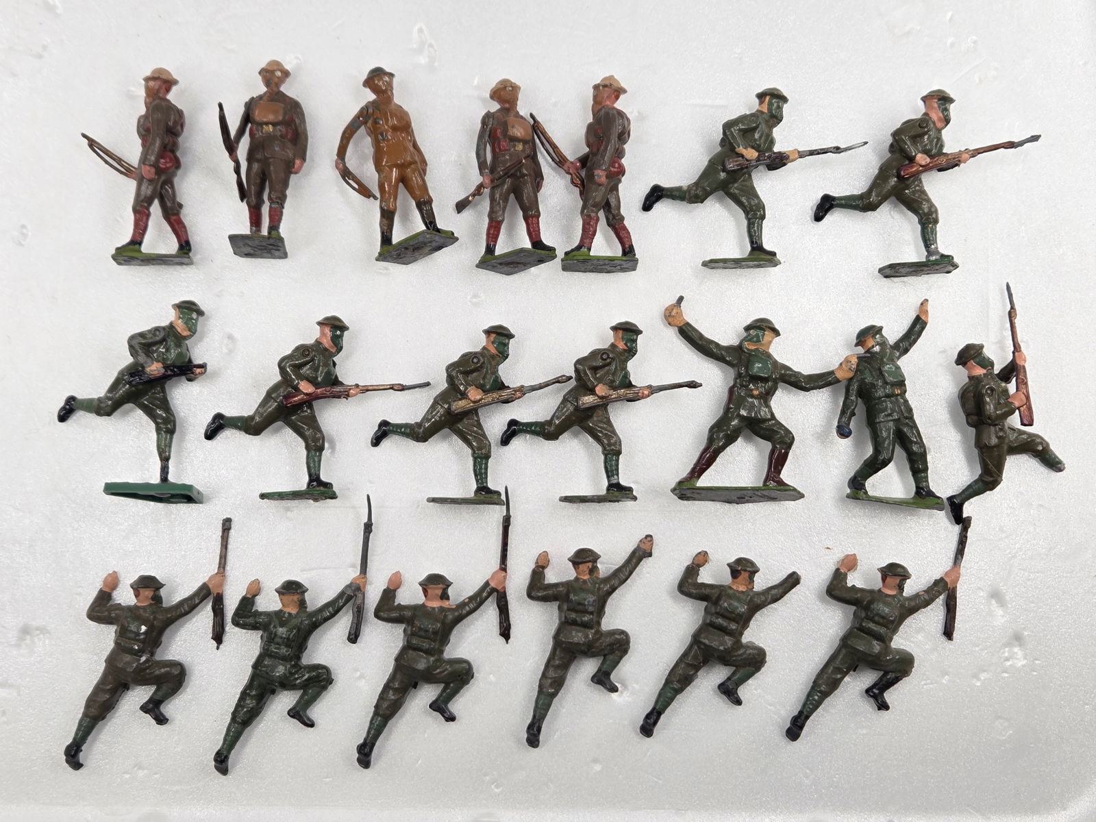 ASSORTED LOT OF VARIOUS LEAD SOLDIERS W/ GAS MASKS: ALL REMAIN IN FAIR TO GOOD CONDITION, SHOWING SOME TYPICAL WEAR. ONE SOLDIER W/ BROKEN LEG. A FEW WITH BROKEN RIFLES OR TIPS.