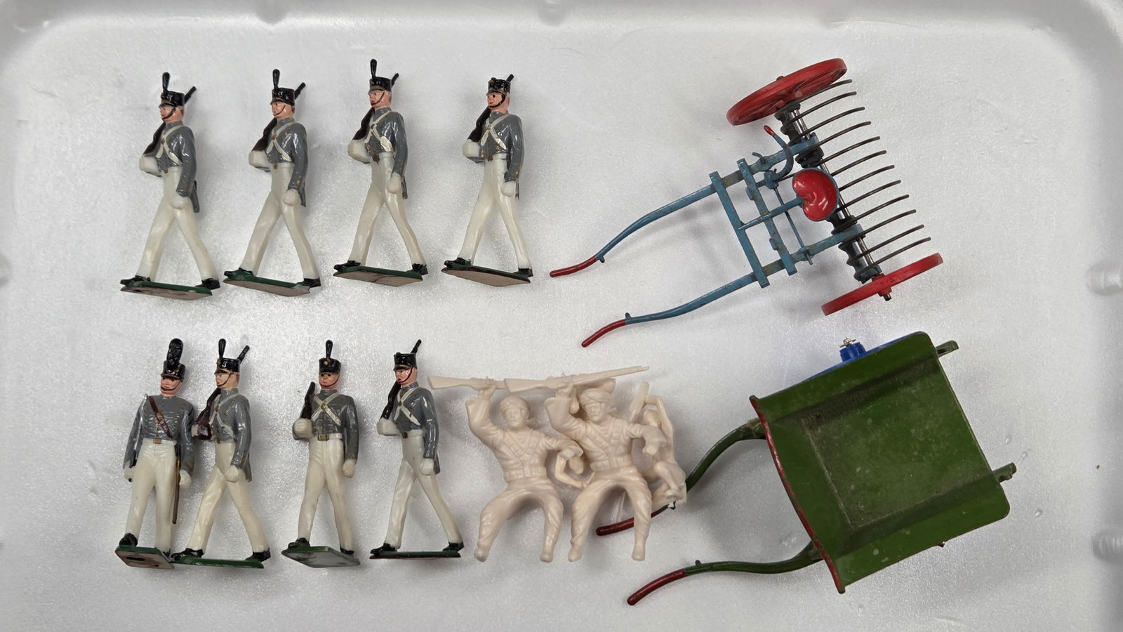 VARIOUS PLASTIC SOLDIERS & 2 METAL FARM IMPLEMENTS: ALL REMAIN IN GOOD CONDITION. IMPLEMENTS SHOWING SOME WEAR.