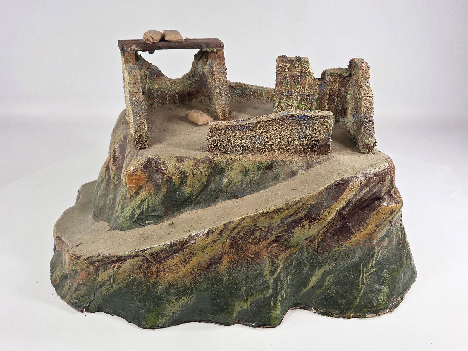 ANTIQUE GERMAN COMPOSITION MOUNTAIN RUINS: REMAINS IN GOOD CONDITION, SHOWING SOME TYPICAL USAGE WEAR. CRACK ALONG ONE SIDE EDGE, AS SHOWN.