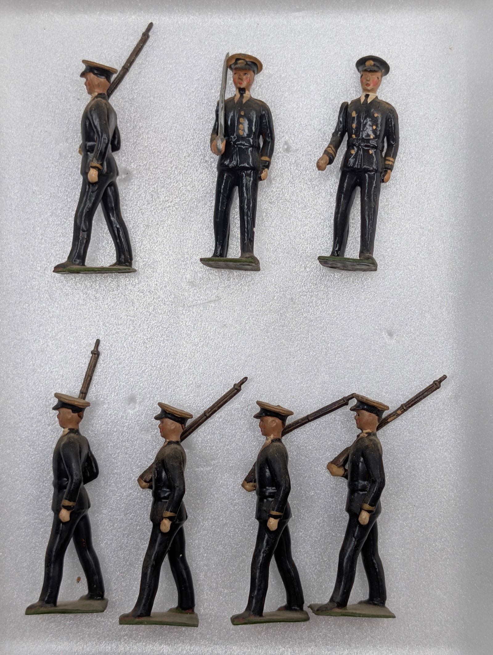 SET OF 7 VINTAGE BRITAINS LEAD SOLDIERS: ALL REMAIN IN GOOD CONDITION, SHOWING SOME TYPICAL WEAR.