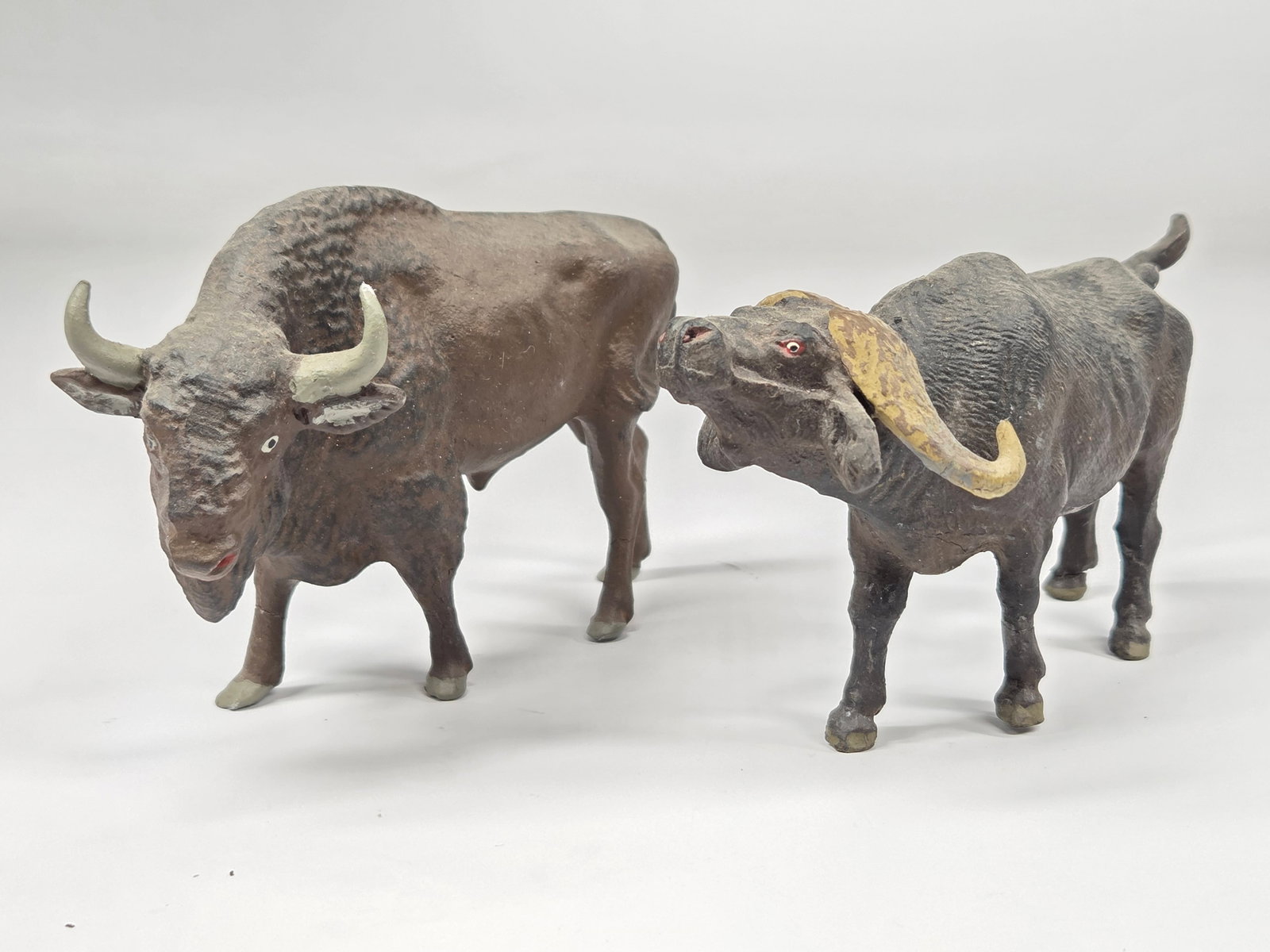 ANTIQUE GERMAN COMPOSITION BUFFALO & BISON: BOTH REMAIN IN GOOD CONDITION, SHOWING SOME TYPICAL WEAR.