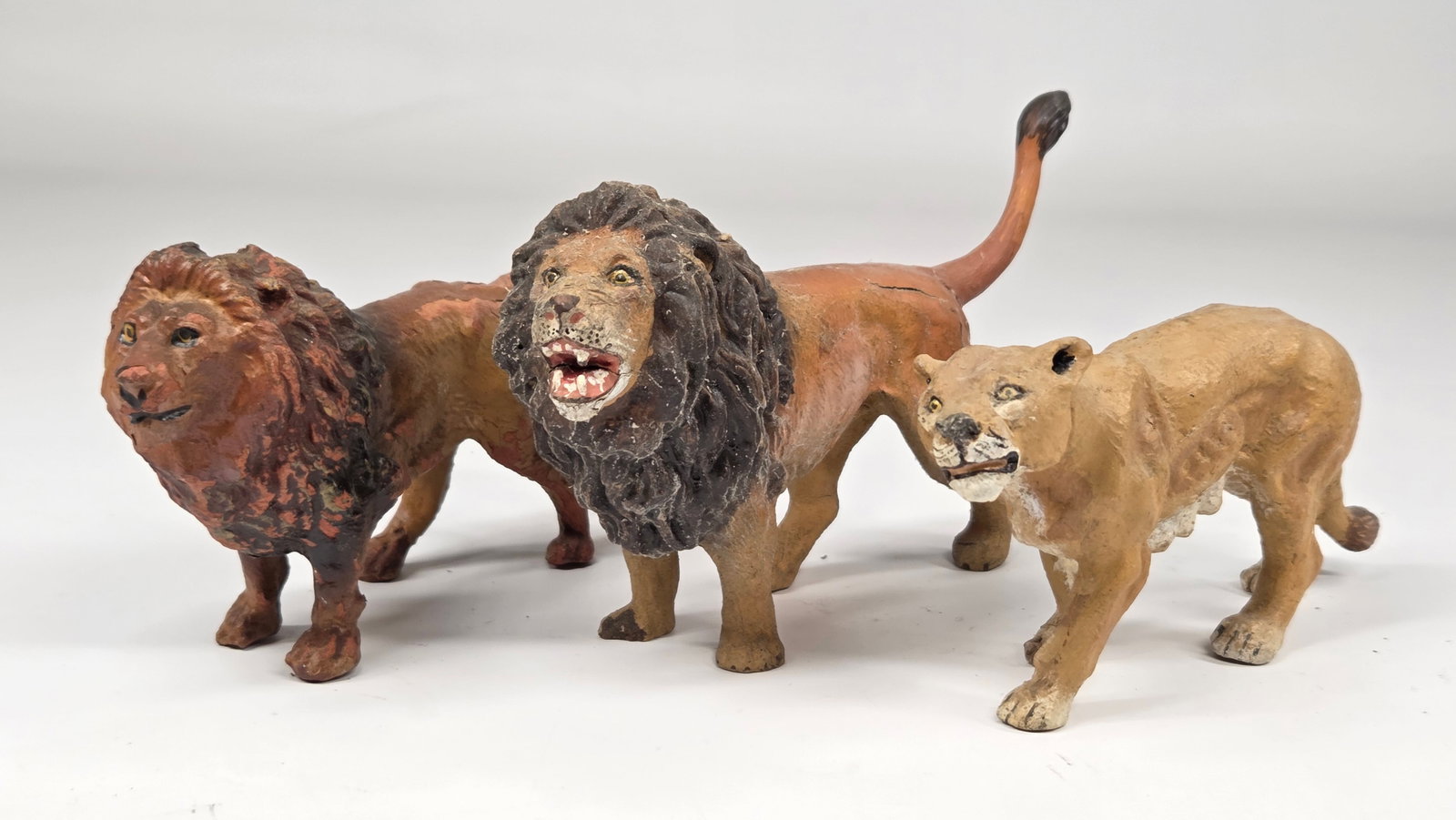 3) ANTIQUE GERMAN COMPOSITION LIONS: ALL REMAIN IN GOOD CONDITION, SHOWING SOME TYPICAL WEAR. ONE LION WITH SOME CRACKING TO BODY.