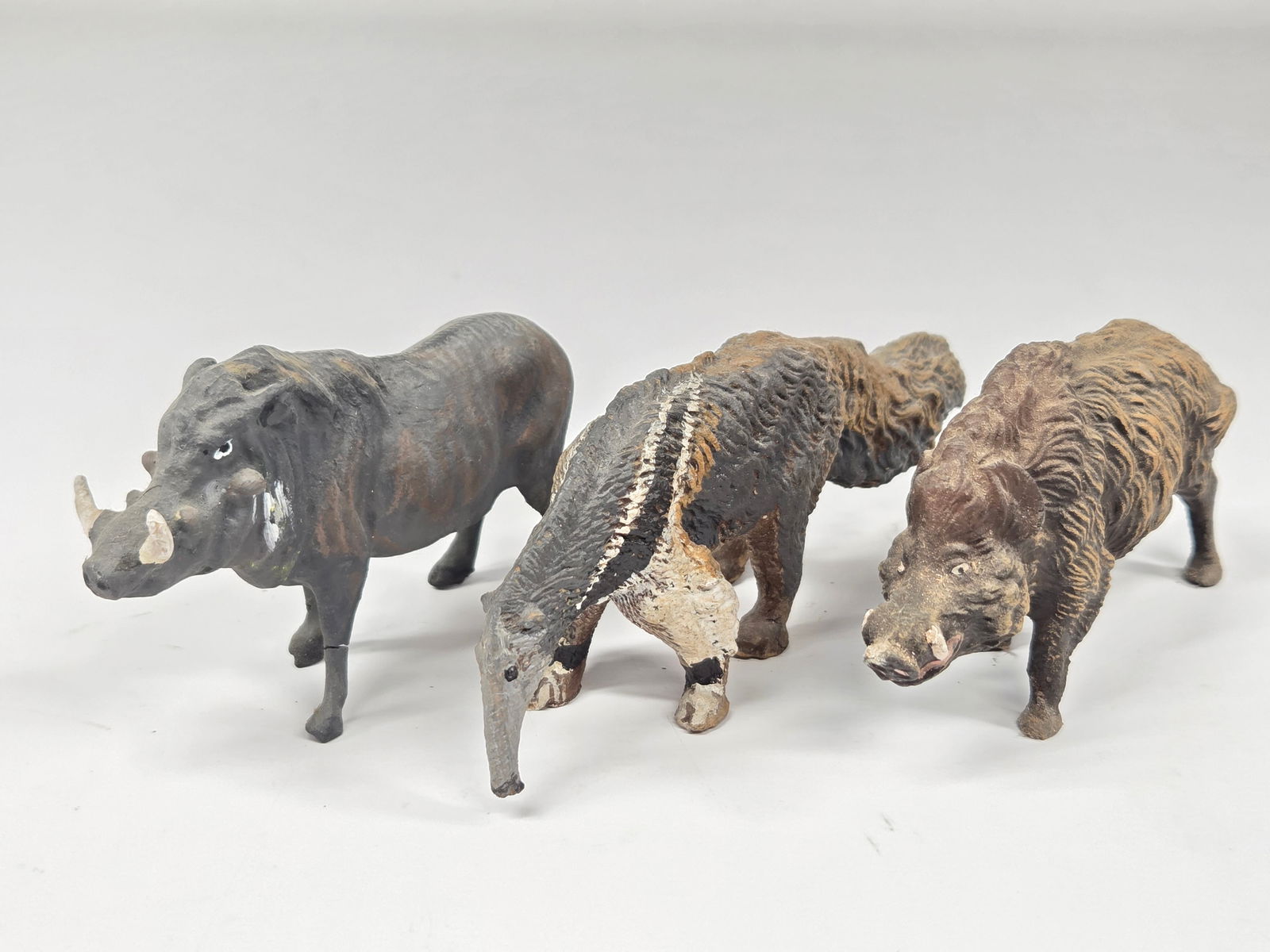 3) ANTIQUE GERMAN COMPOSITION ANIMALS: ALL REMAIN IN GOOD CONDITION, SHOWING SOME TYPICAL WEAR.