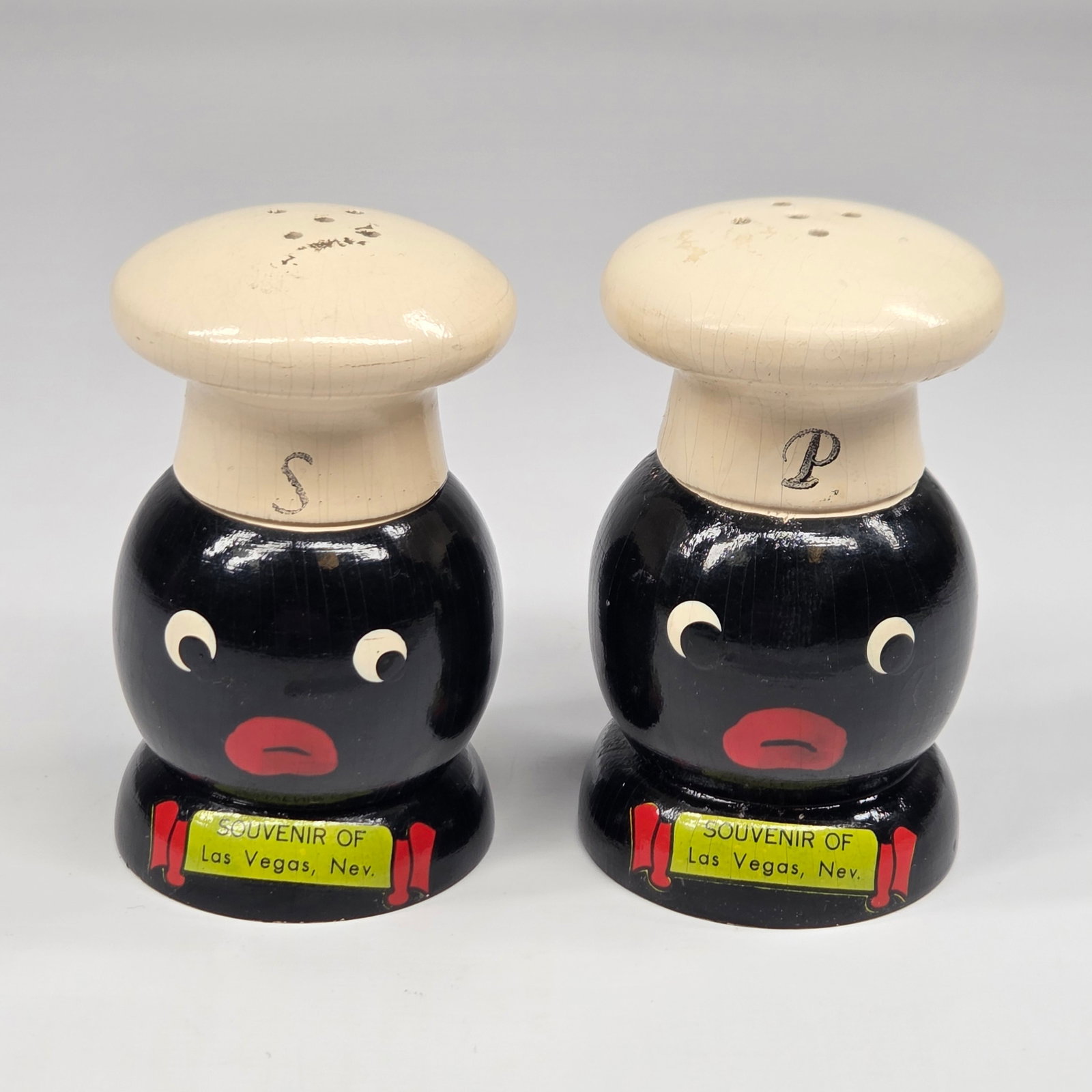 SOUVENIR LAS VEGAS BLACK AMERICANA SALT & PEPPER: SET REMAINS IN GOOD CONDITION, SHOWING SOME TYPICAL WEAR.