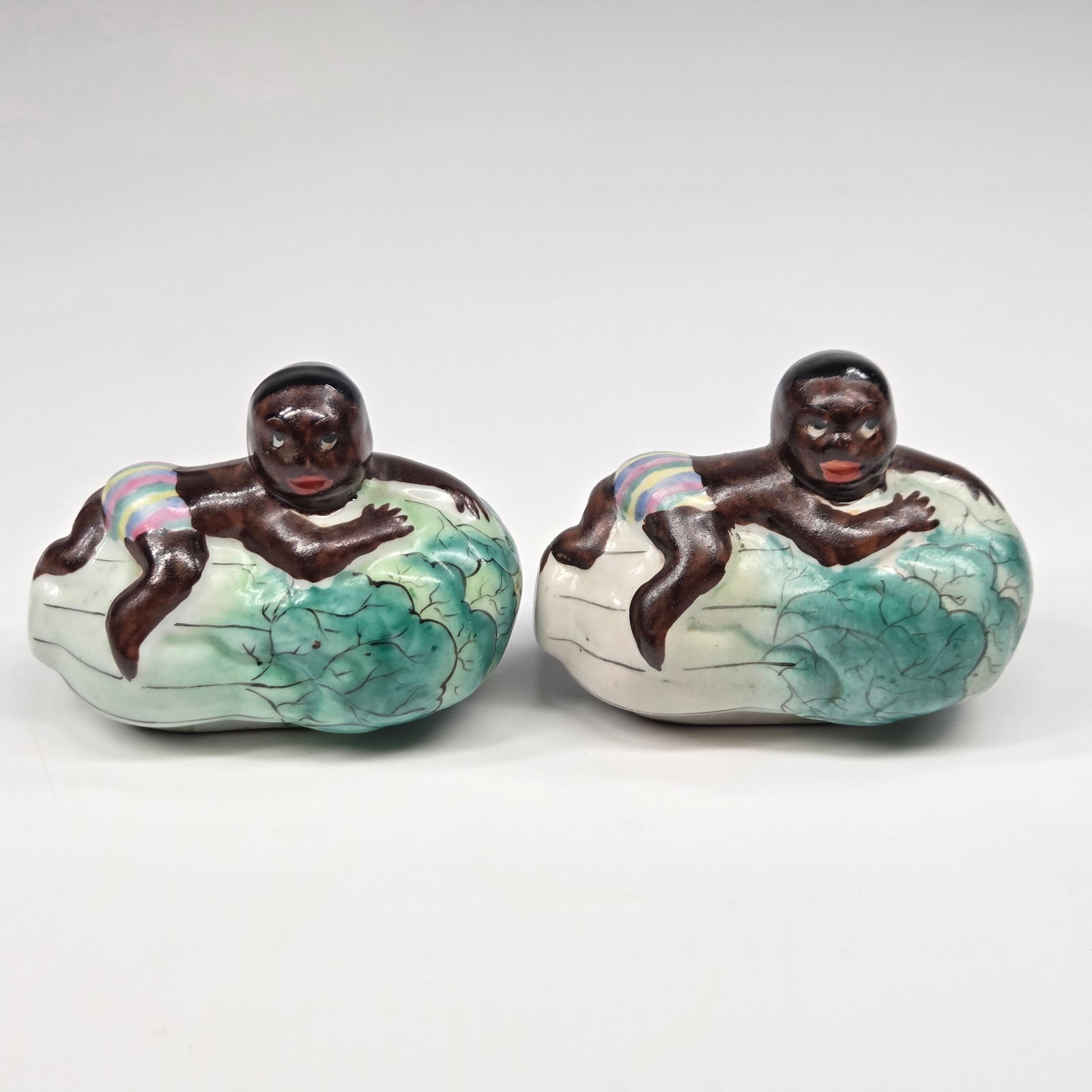 BLACK AMERICANA BABY ON WATERMELON SALT & PEPPER: SET REMAINS IN GOOD CONDITION, SHOWING SOME TYPICAL WEAR. NO CHIPS OR CRACKS.