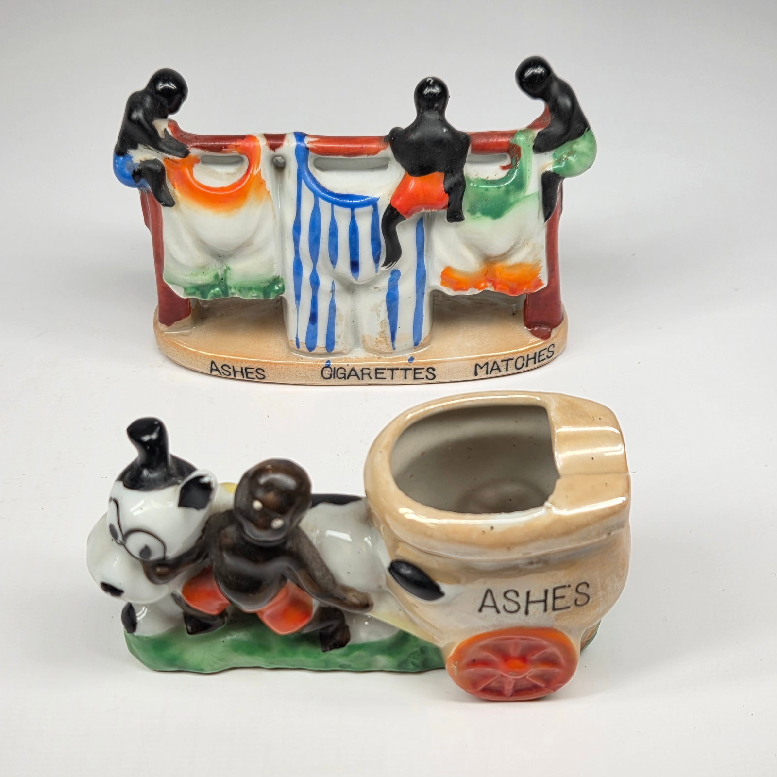 2) VINTAGE JAPAN BISQUE BLACK AMERICANA ASHTRAYS: BOTH REMAIN IN GOOD CONDITION. NO CHIPS OR CRACKS.
