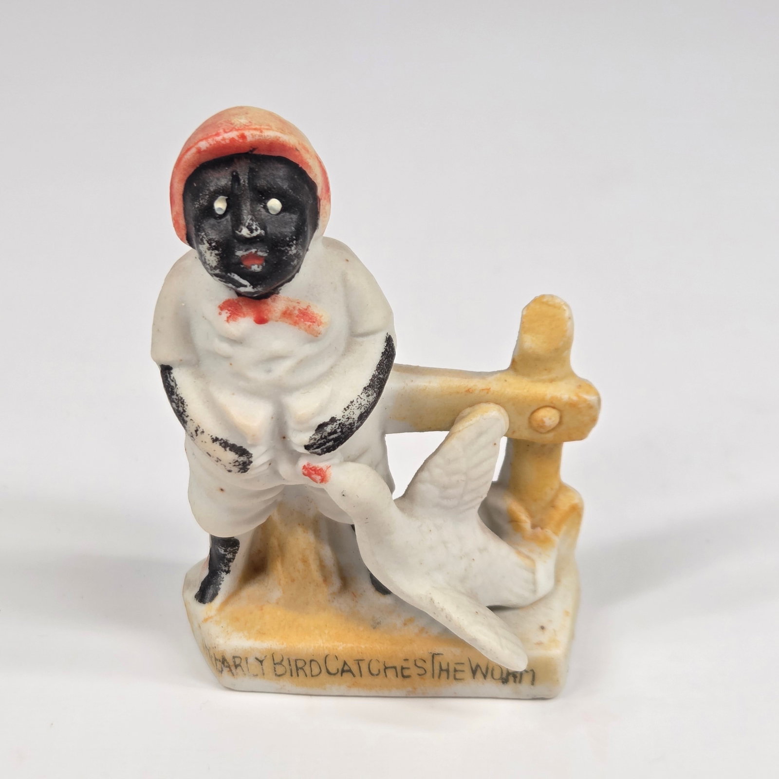 JAPAN BISQUE NAUGHTY EARLY BIRD CATCHES WORM: REMAINS IN GOOD CONDITION, SHOWING SOME PAINT WEAR. NO CHIPS OR CRACKS.