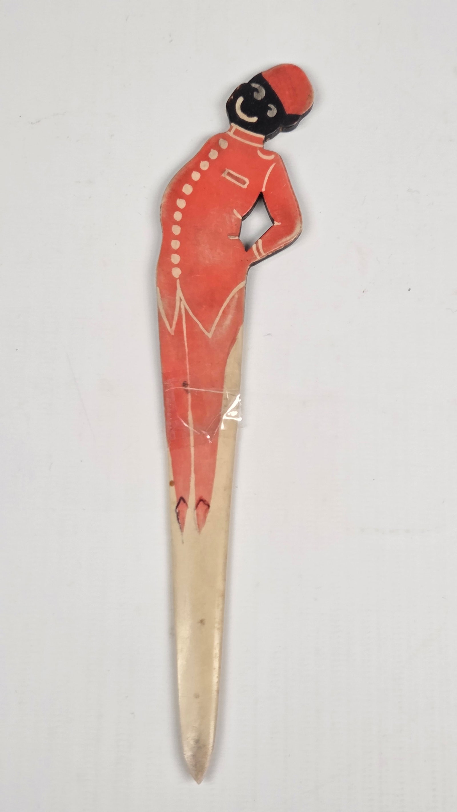ANTIQUE CELLULOID BLACK AMERICANA LETTER OPENER: REMAINS IN POOR CONDITION, BROKEN IN HALF.