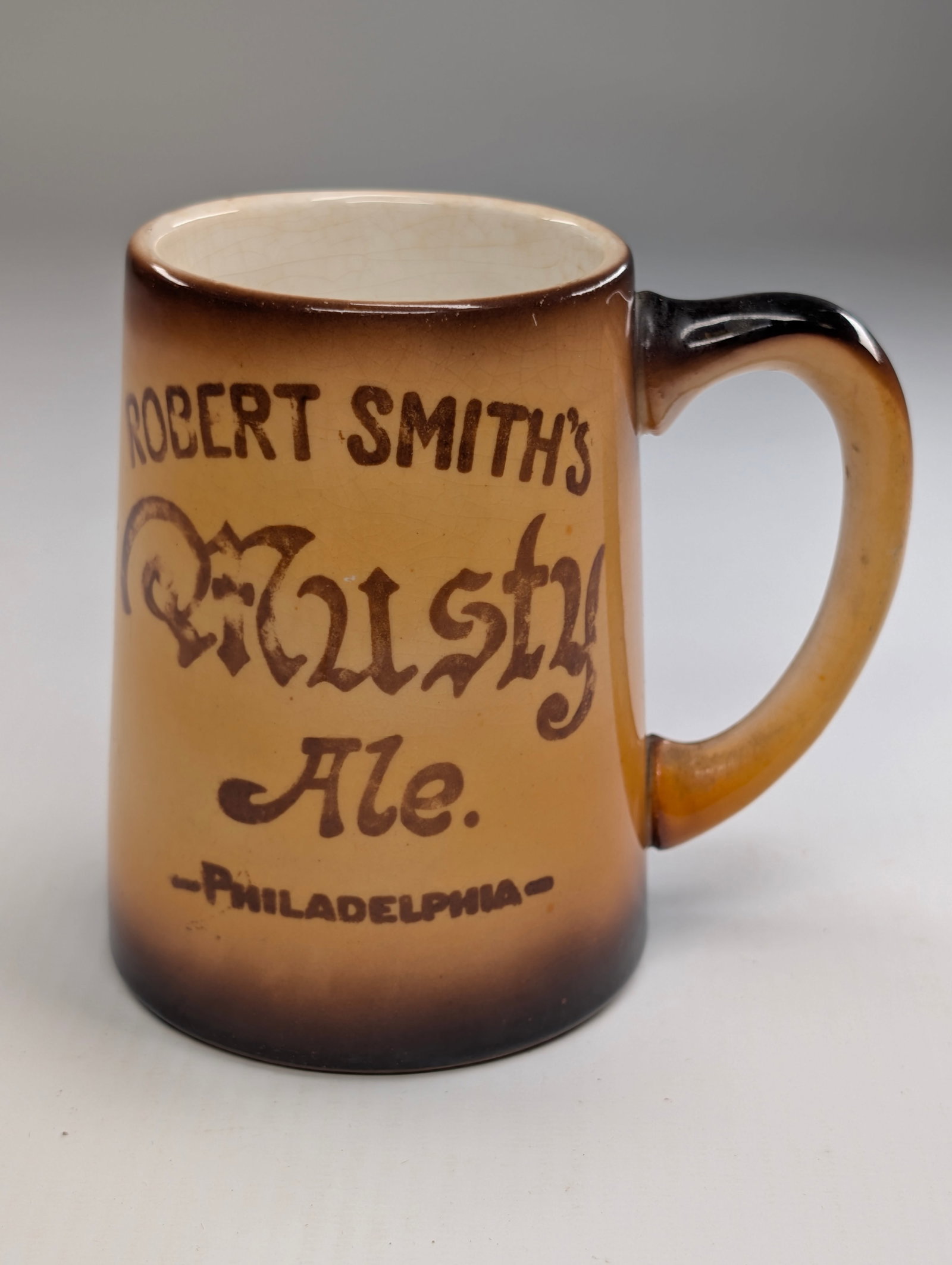 ROBERT SMITH'S MUSTY ALE PHILA PA TANKARD: REMAINS IN GOOD CONDITION, SHOWING SOME TYPICAL WEAR.