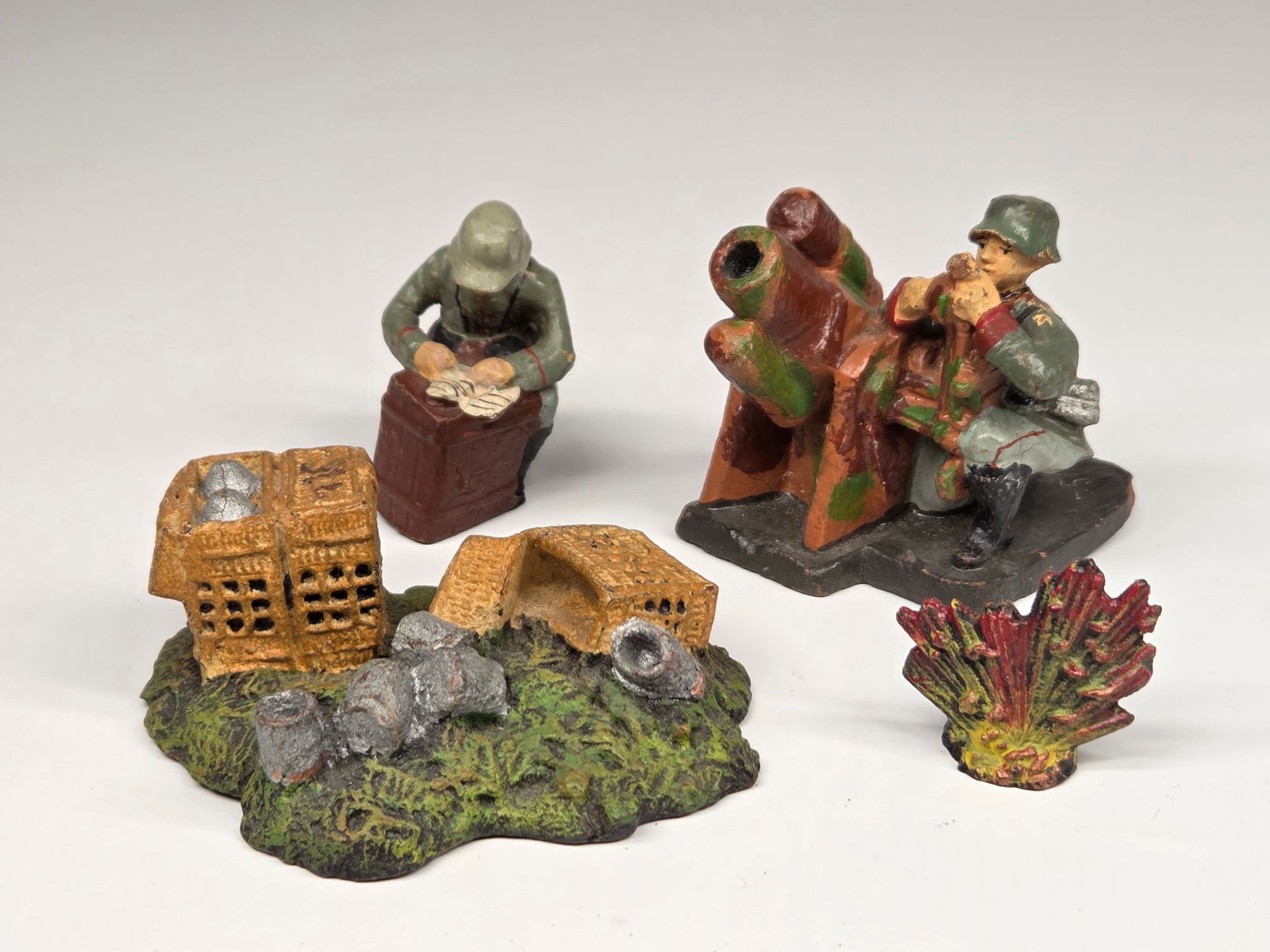 GERMAN ELASTOLIN COMPOSITION EXPLOSION, MORTAR +: ALL ITEMS REMAIN IN GOOD CONDITION, SHOWING SOME TYPICAL WEAR AND CRACKING.