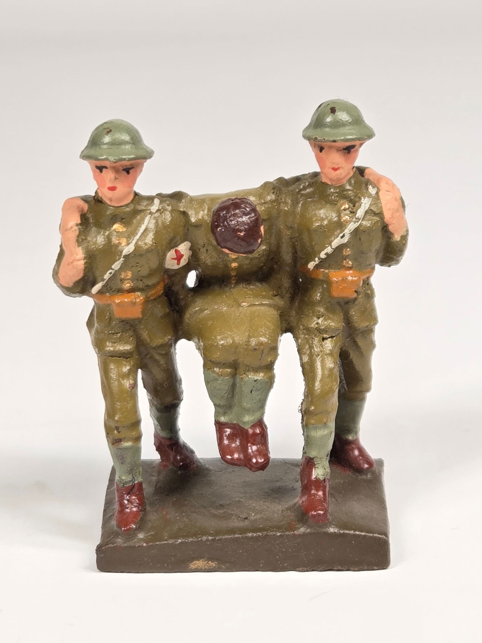 LINEOL GERMAN COMPOSITION SOLDIERS CARRYING WOUNDED: REMAINS IN GOOD CONDITION, SHOWING SOME TYPICAL WEAR.