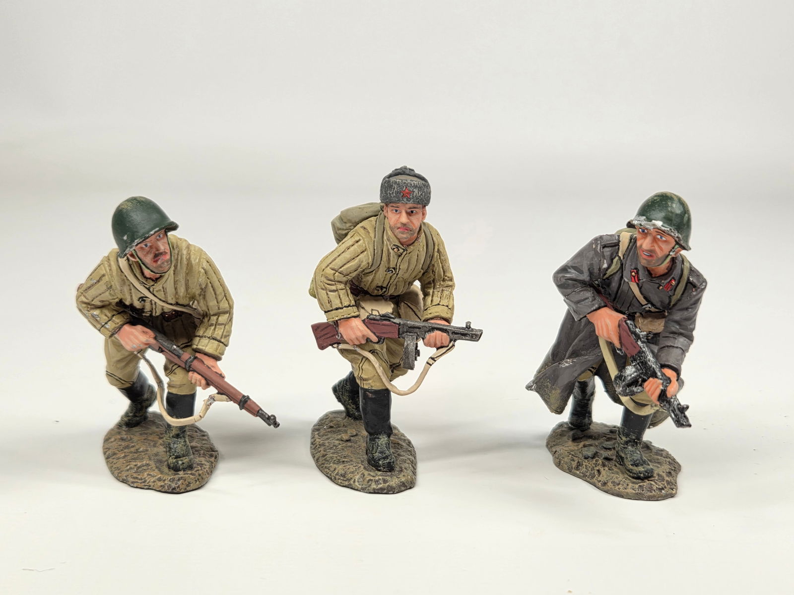 3) KING & COUNTRY RED ARMY SOLDIERS: ALL REMAIN IN GOOD CONDITION. 2 WITH BREAKS IN GUN STRAPS.