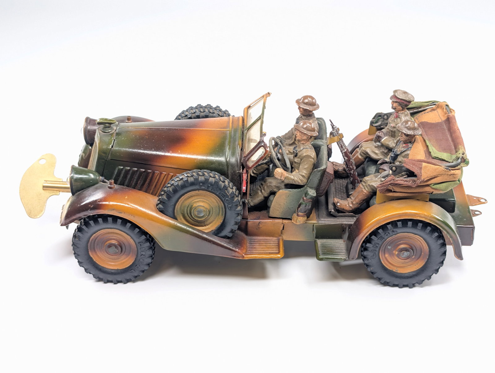 LINEOL ELASTOLIN GERMAN BATTERY OPERATED TROOP CARRIER: REMAINS IN VERY GOOD CONDITION OVERALL. SHOWING SOME LIGHT PAINT WEAR. WIND UP MECHANISM WORKS, AS WELL AS WIND UP MECHANISM. ALL SOLDIERS REMAIN IN GOOD CONDITION, SHOWING SOME LIGHT TYPICAL WEAR. CA