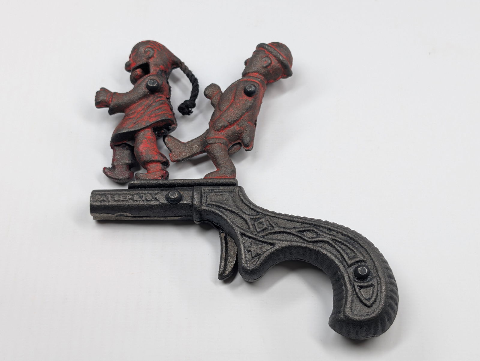 REPRODUCTION IVES CAST IRON THE CHINESE MUST GO CAP GUN: REMAINS IN GOOD CONDITION, SHOWING SOME TYPICAL WEAR.