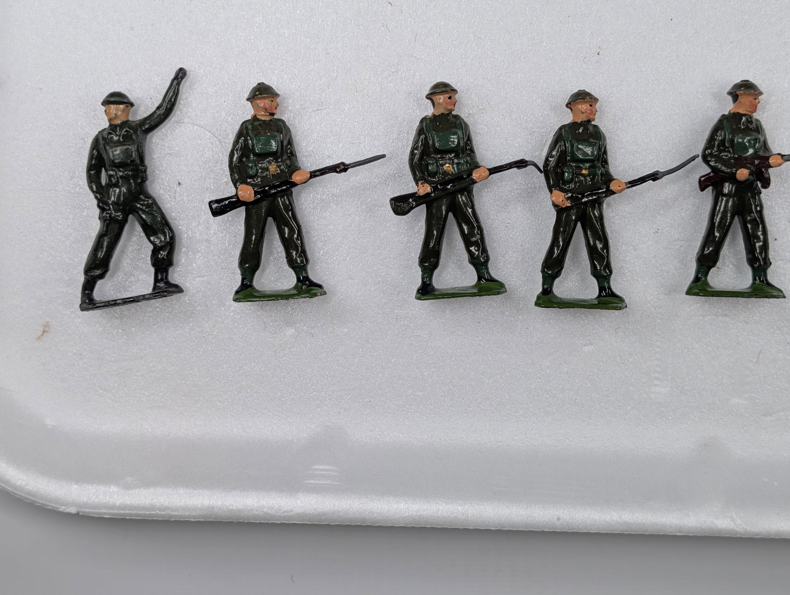 SET OF 7 BRITAIN LEAD SOLDIERS: ALL REMAIN IN GOOD CONDITION, SHOWING SOME TYPICAL WEAR.