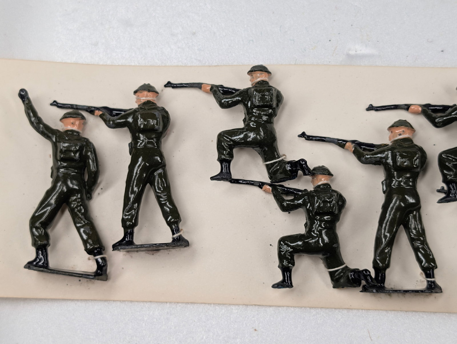 SET OF 11 HAND PAINTED LEAD SOLDIERS: ALL REMAIN IN GOOD CONDITION, SHOWING SOME TYPICAL WEAR.