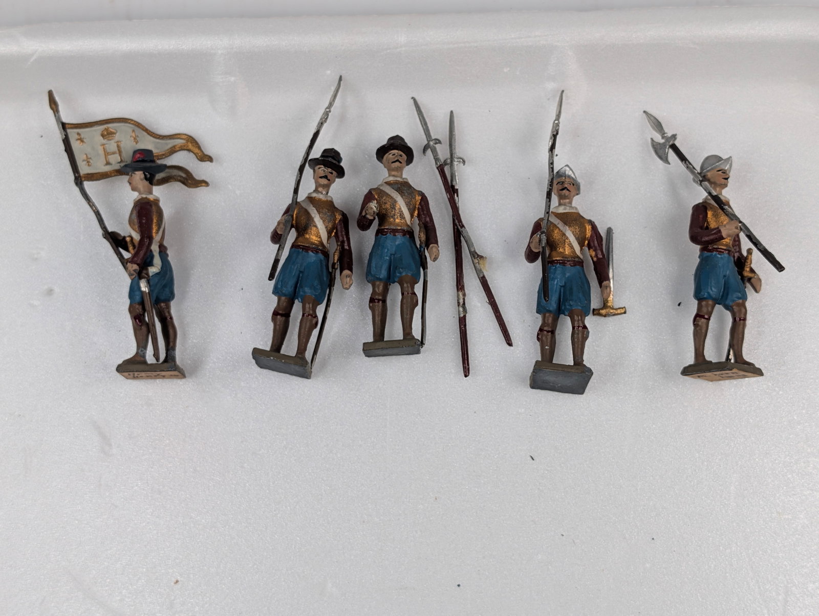 SET OF 5 HAND PAINTED LEAD SOLDIERS: ALL REMAIN IN GOOD CONDITION, SHOWING SOME TYPICAL WEAR. SOME GLUE RESIDUE.