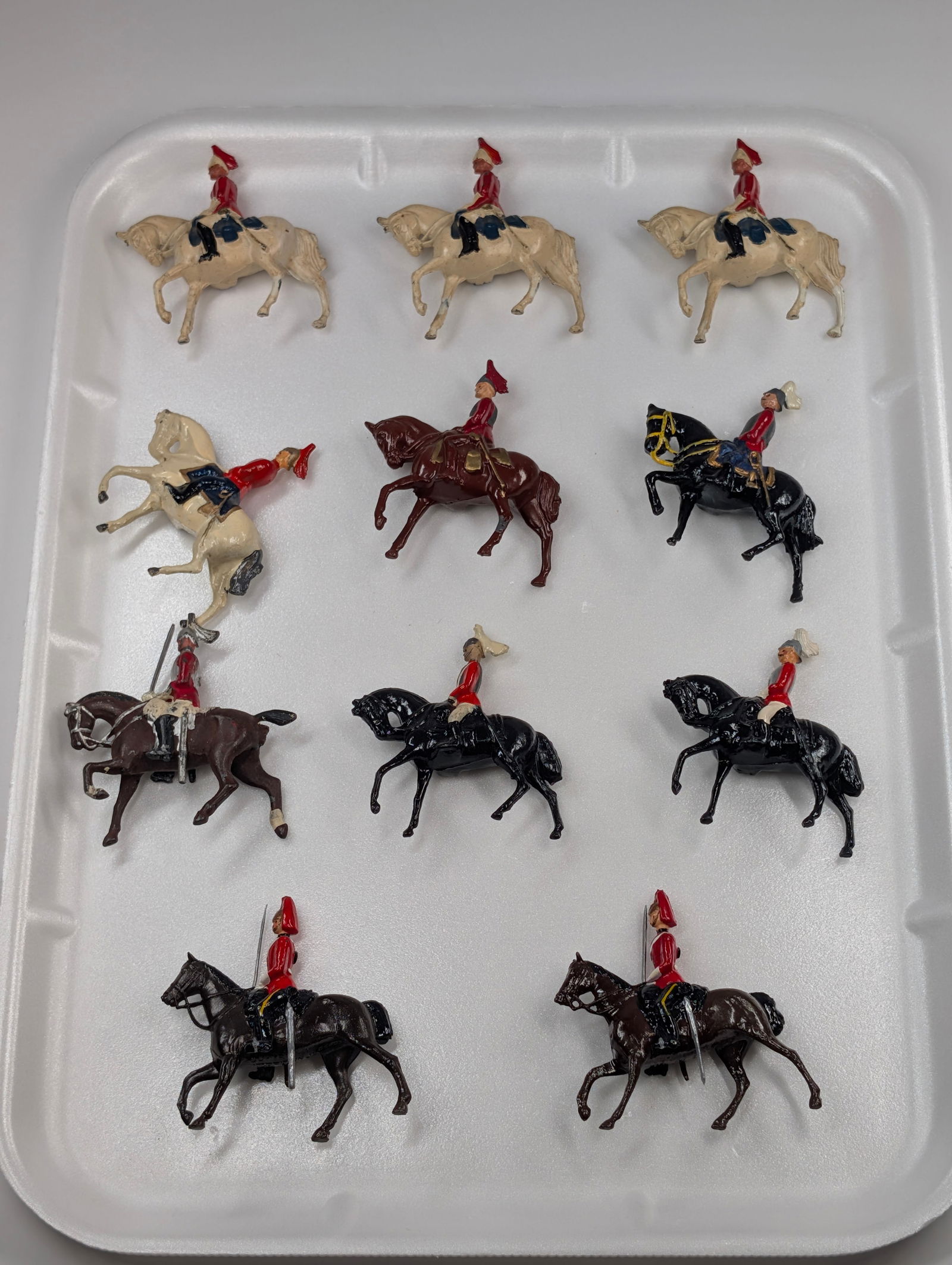 11) VINTAGE BRITAIN MOUNTED LANCERS: ALL REMAIN IN FAIR TO GOOD CONDITION, SHOWING SOME TYPICAL WEAR. ONE BROWN HORSE SHOWN REPAINT.