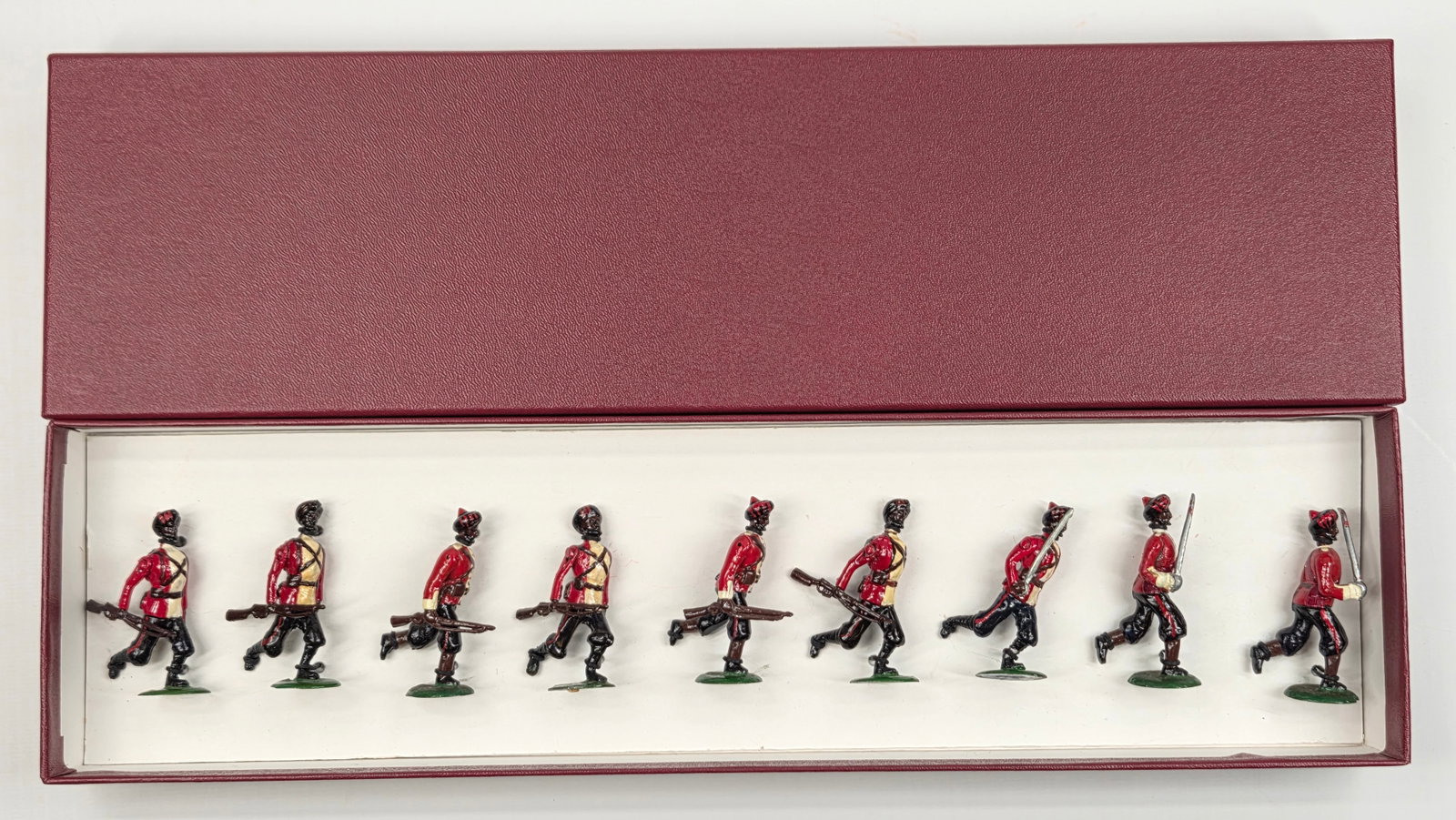 UNMARKED SET OF 9 HAND PAINTED LEAD SOLDIERS: ALL REMAIN IN GOOD CONDITION, SHOWING SOME PAINT WEAR.