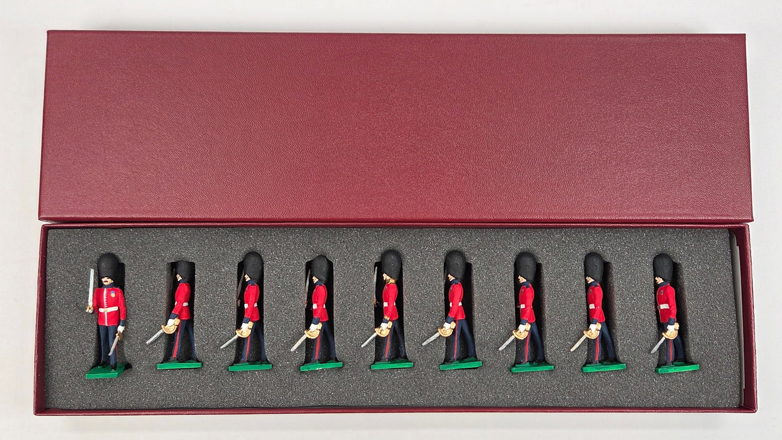 SET OF 9 UNMARKED HAND PAINTED LEAD GUARDS: ALL REMAIN IN GOOD CONDITION.
