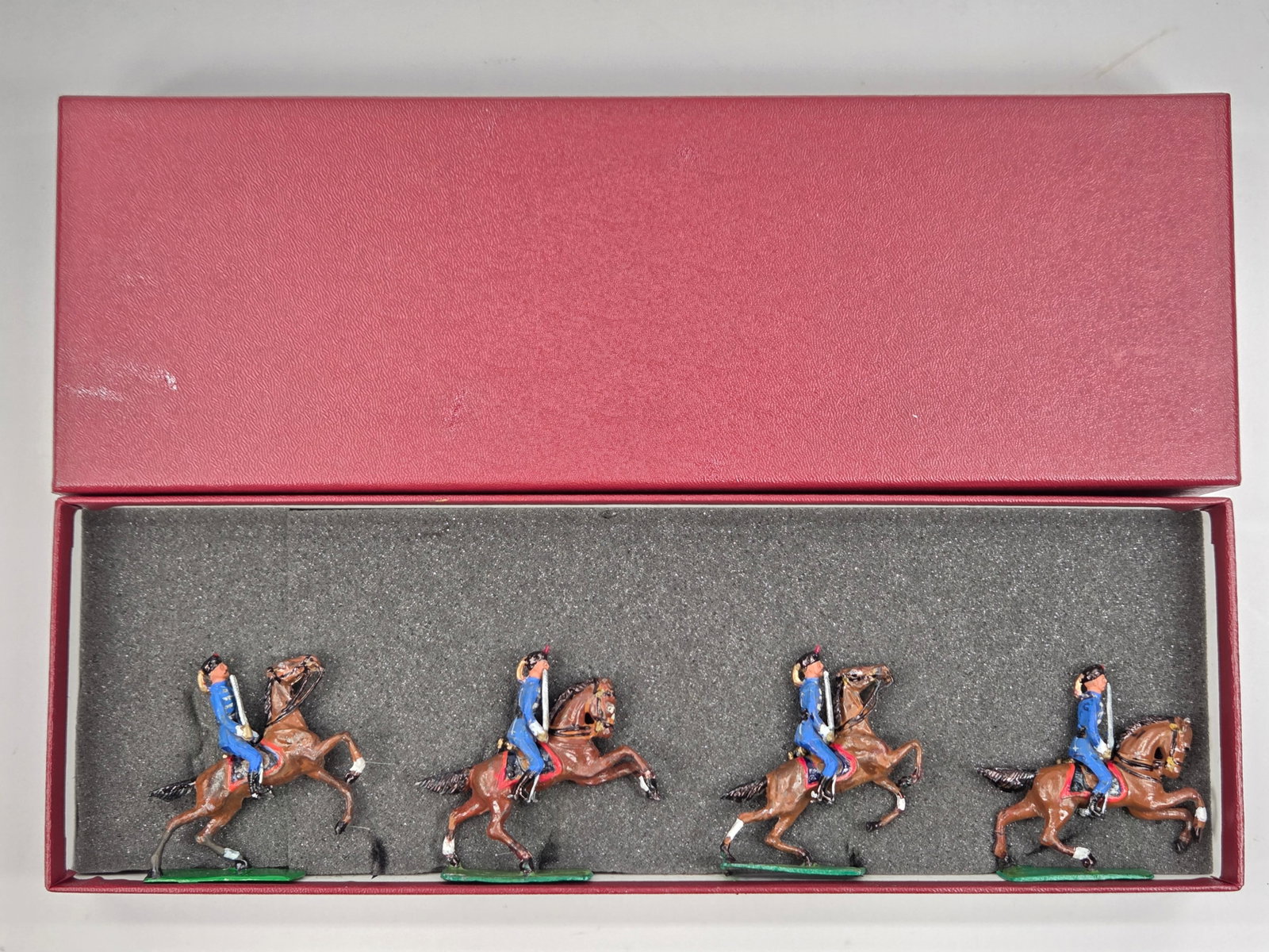 UNMARKED SET OF 4 HAND PAINTED MOUNTED SOLDIERS: ALL REMAIN IN GOOD CONDITION, SHOWING SOME PAINT WEAR.