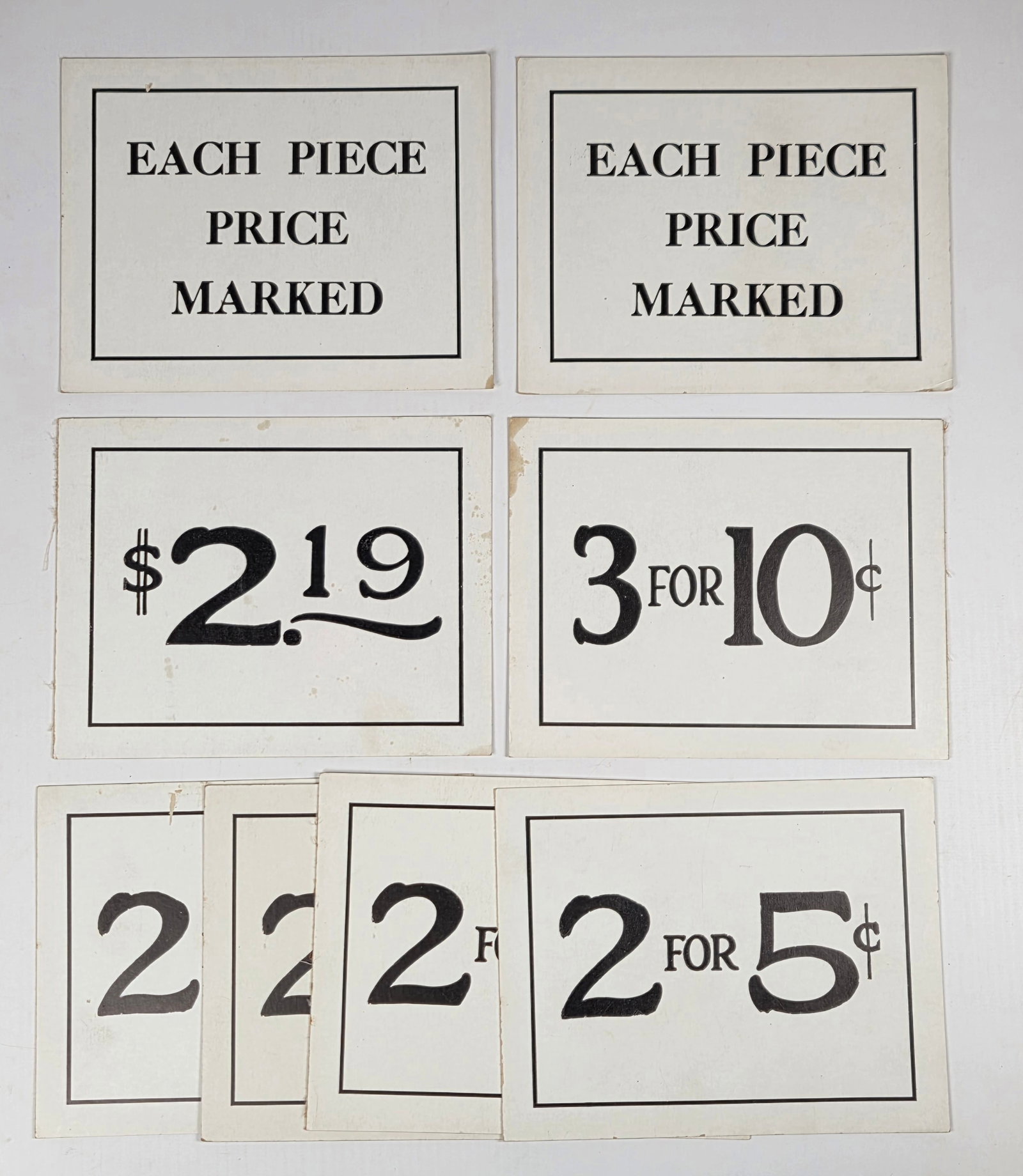 8) DOUBLE SIDED COUNTRY STORE PRICE SIGNS: ALL REMAIN IN GOOD CONDITION, SHOWING SOME TYPICAL WEAR.