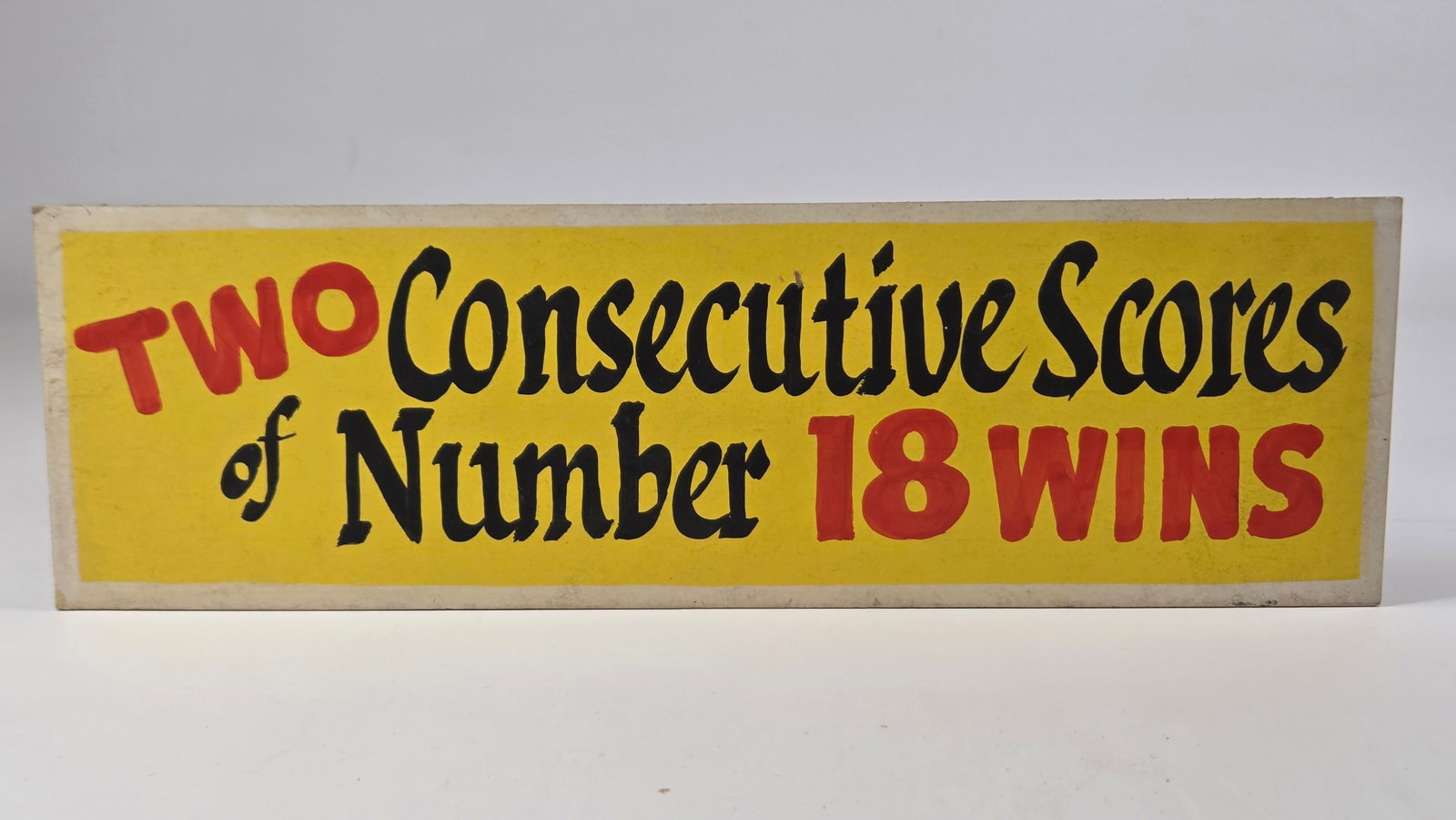 CARNIVAL SIGN - TWO CONSECUTIVE SCORES WINS: CARDBOARD SIGN REMAINS IN GOOD CONDITION.