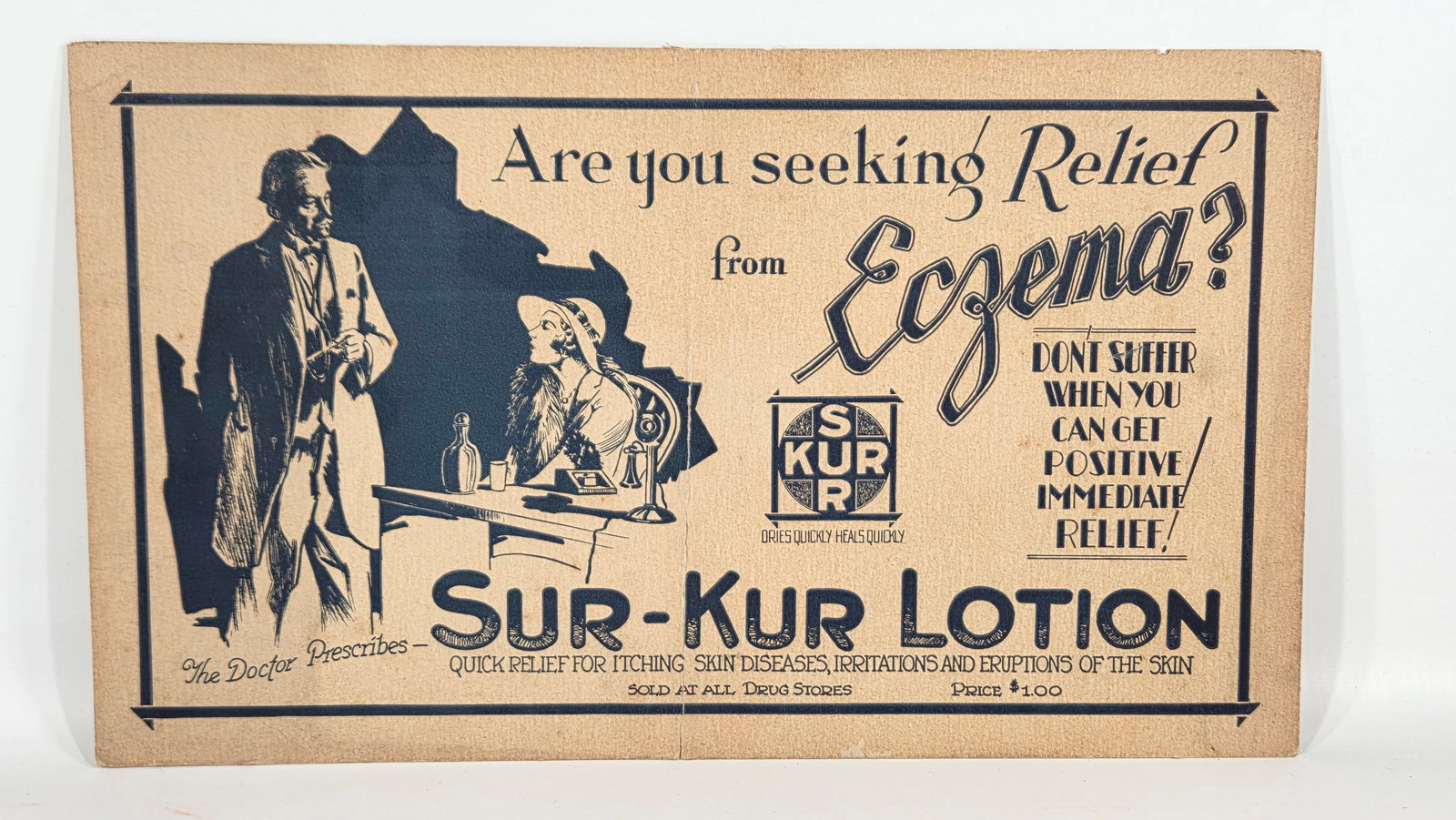SUR-KUR LOTION ADVERTISING CARDBOARD SIGN: REMAINS IN FAIR TO GOOD CONDITION, SHOWING SOME TYPICAL WEAR. CREASE ALONG MIDDLE OF SIGN.