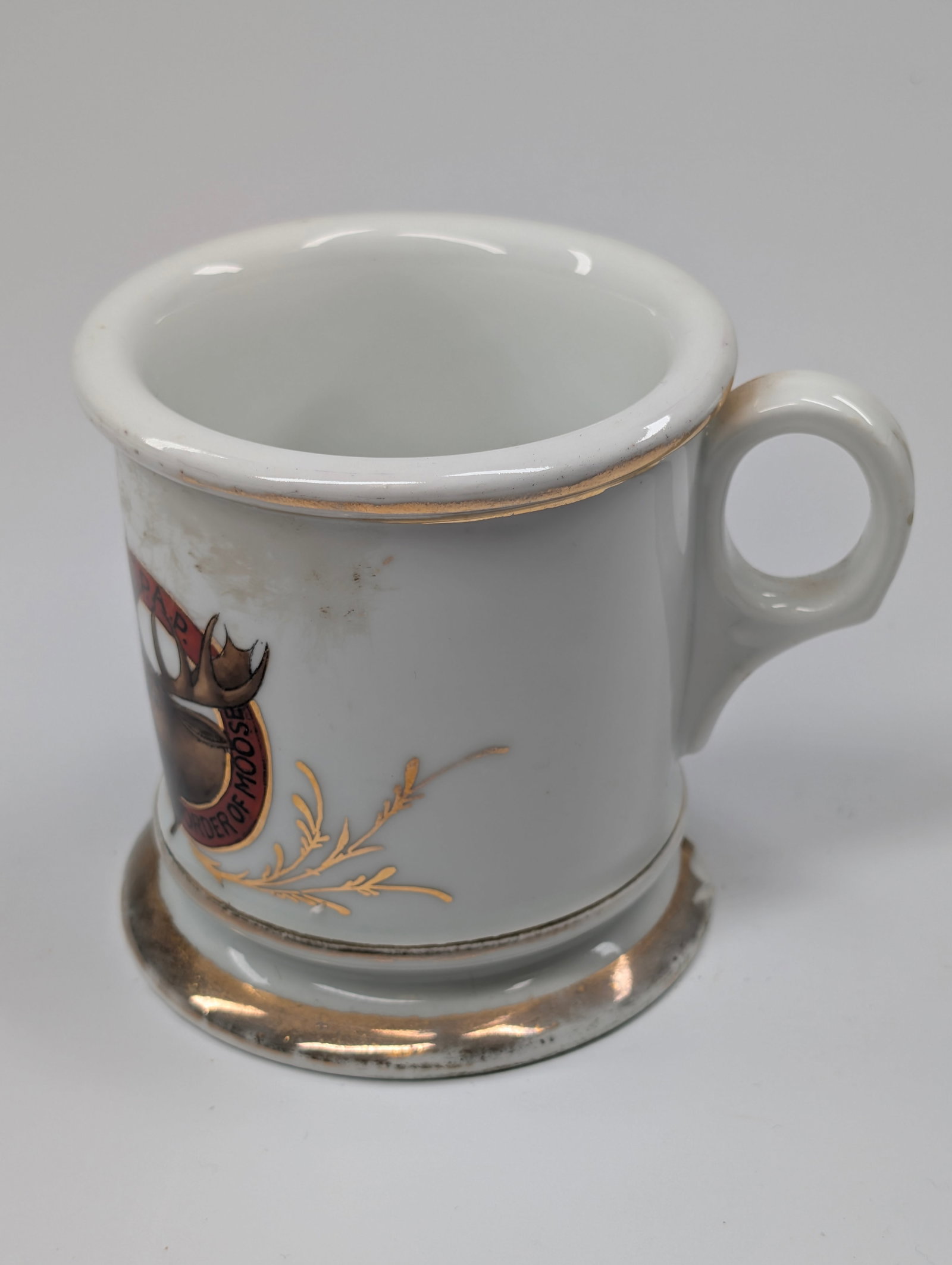 LOYAL ORDER OF THE MOOSE FRATERNAL SHAVING MUG: REMAINS IN FAIR TO GOOD CONDITION, ATTRACTIVE DECORATION, SHOWS SOME TYPICAL WEAR INCLUDING CHIP ON BASE
