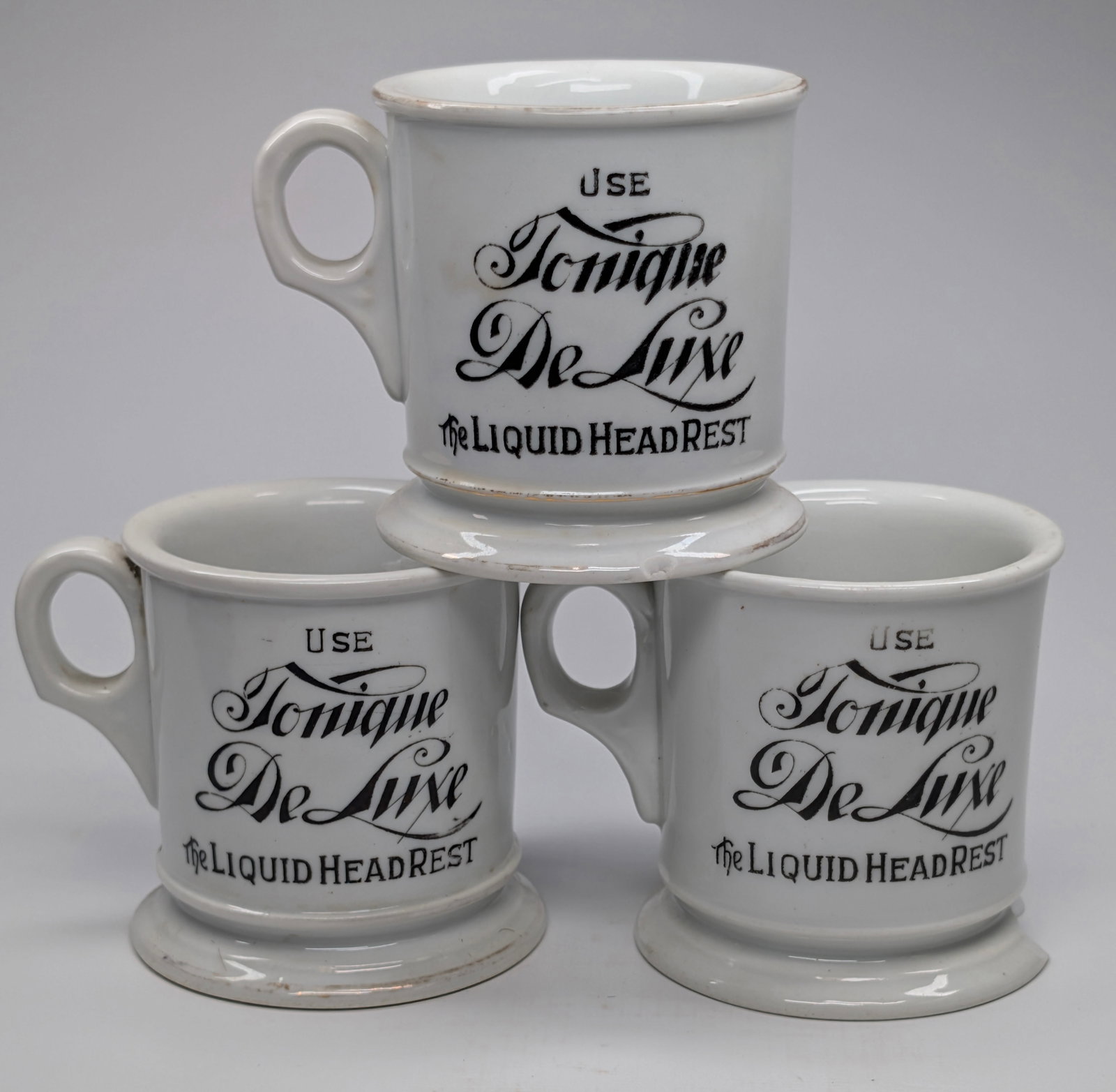 3) KOKEN TONIQUE DE LUXE ADVERTISING SHAVING MUGS: EACH REMAINS IN FAIR CONDITION - CLEAR PRINTING - CHIPS ON EACH