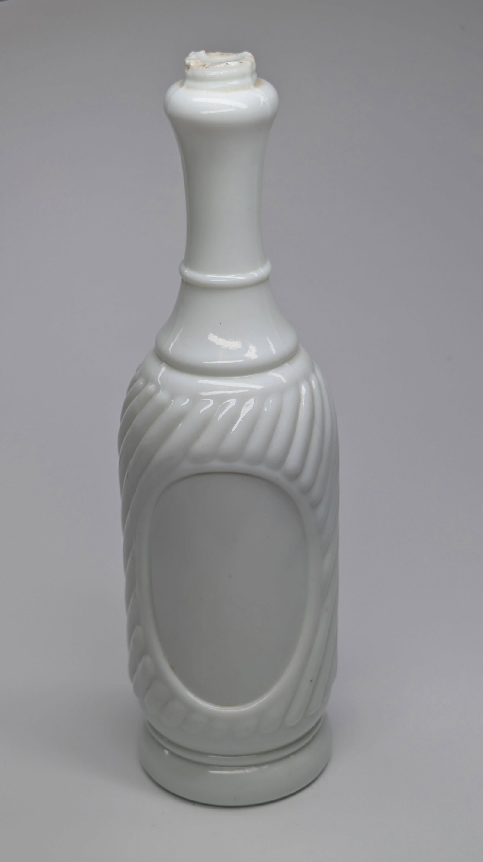 UNMARKED MILK GLASS BARBER'S TONIC BOTTLE: REMAINS IN GOOD CONDITION, NO CHIPS OR CRACKS.