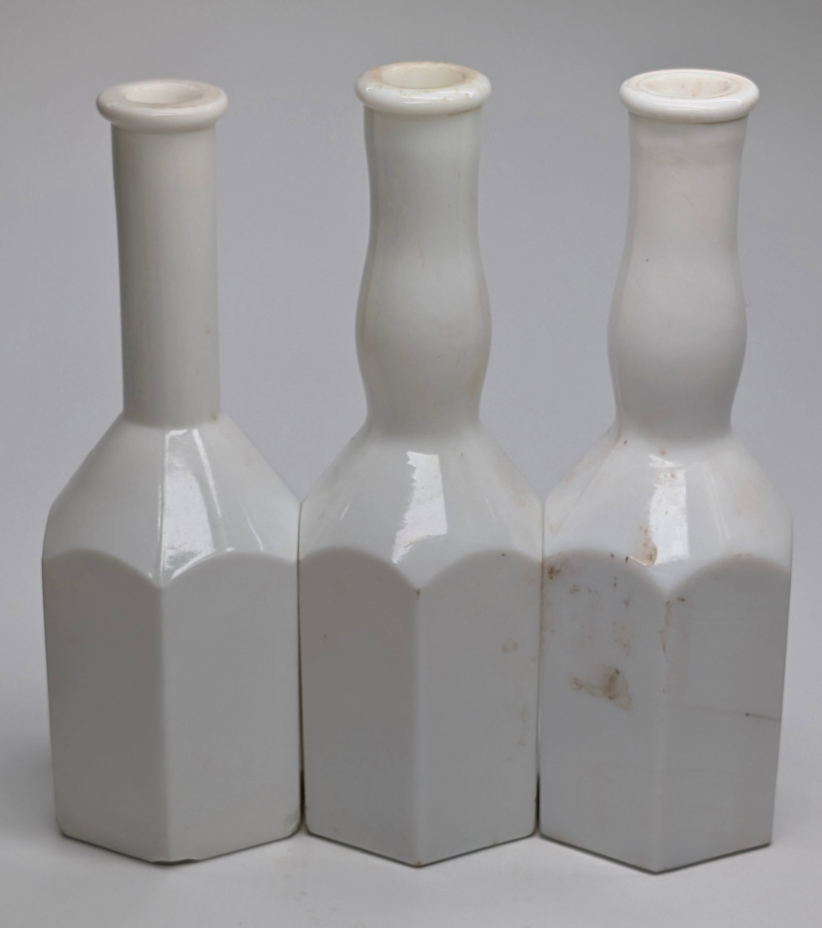 3) 6 SIDED KOKEN MILK GLASS BARBER'S TONIC BOTTLES: REMAIN IN GOOD CONDITION, SHOWING SOME LIGHT WEAR, DUST. CHIPS AT BASE