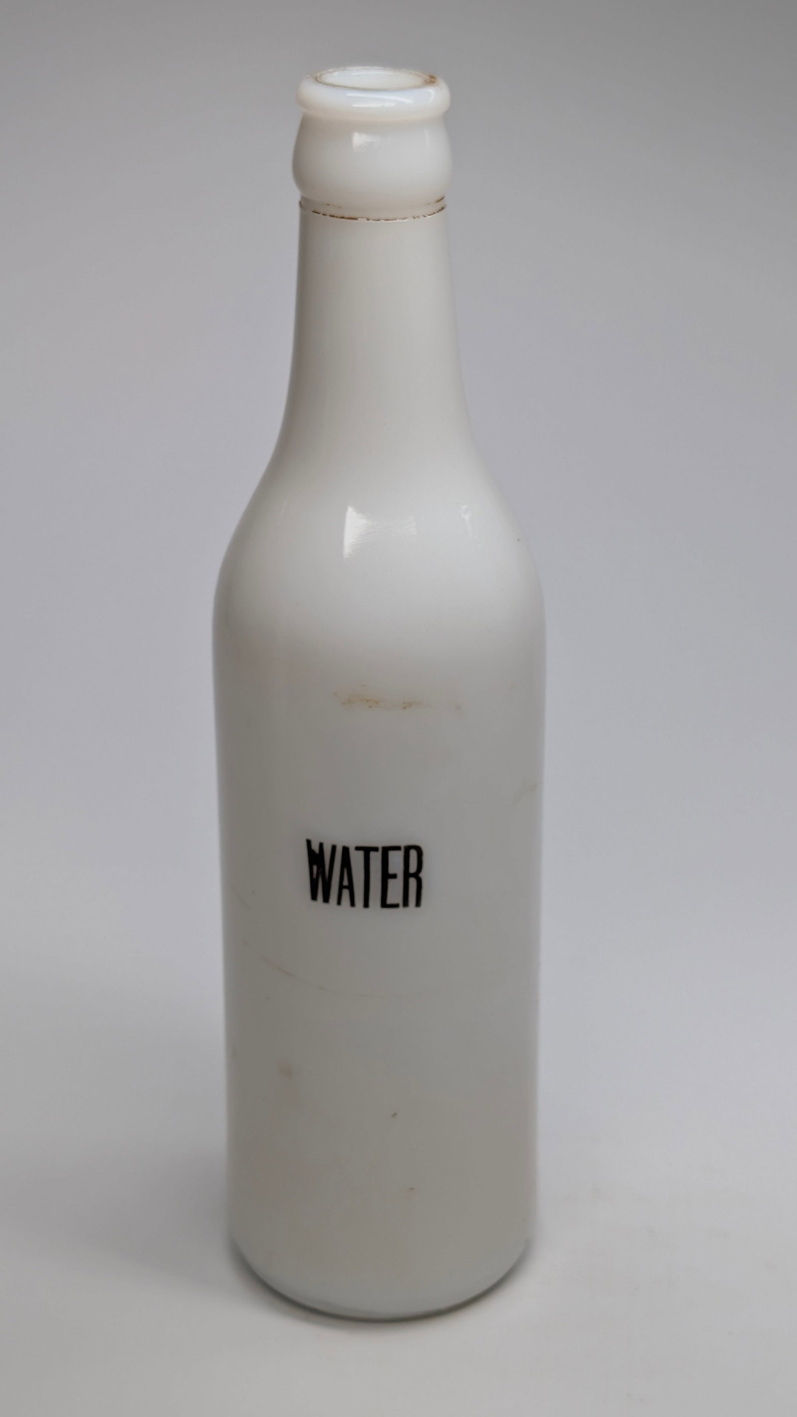ANTIQUE MILK GLASS BARBER'S WATER BOTTLE: REMAINS IN VERY GOOD CONDITION, SHOWING SOME LIGHT WEAR, DUST. NO CHIPS OR CRACKS.