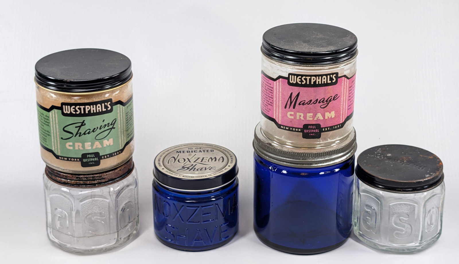 6) MASSAGE & SHAVING CREAM GLASS JARS: ALL REMAIN IN GOOD CONDITION, SHOWING SOME TYPICAL WEAR.