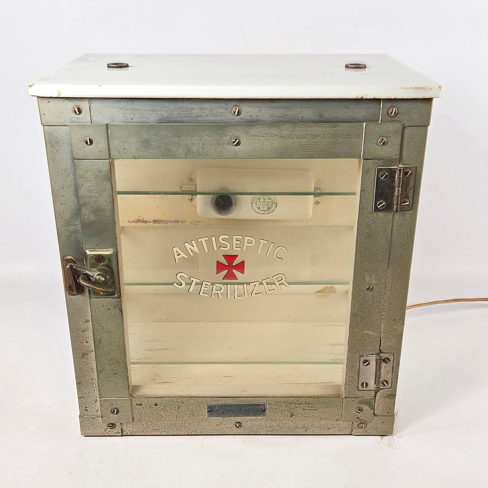 ANTIQUE ANTISEPTIC STERILIZER METAL & WOOD CABINET: REMAINS IN GOOD CONDITION, SHOWING TYPICAL USAGE WEAR.